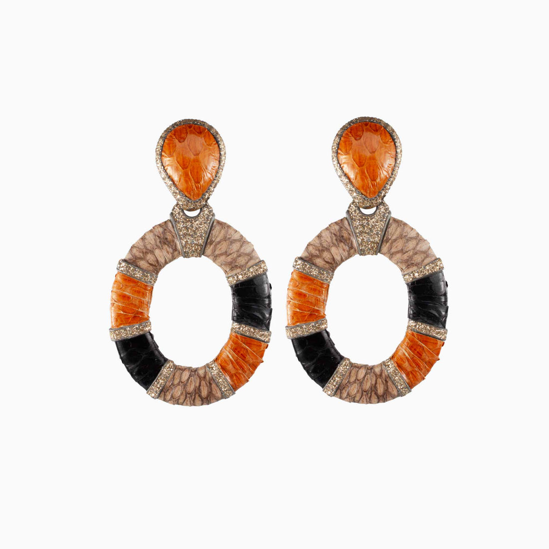 Pair of earrings with orange, black, and beige circular designs on a white background