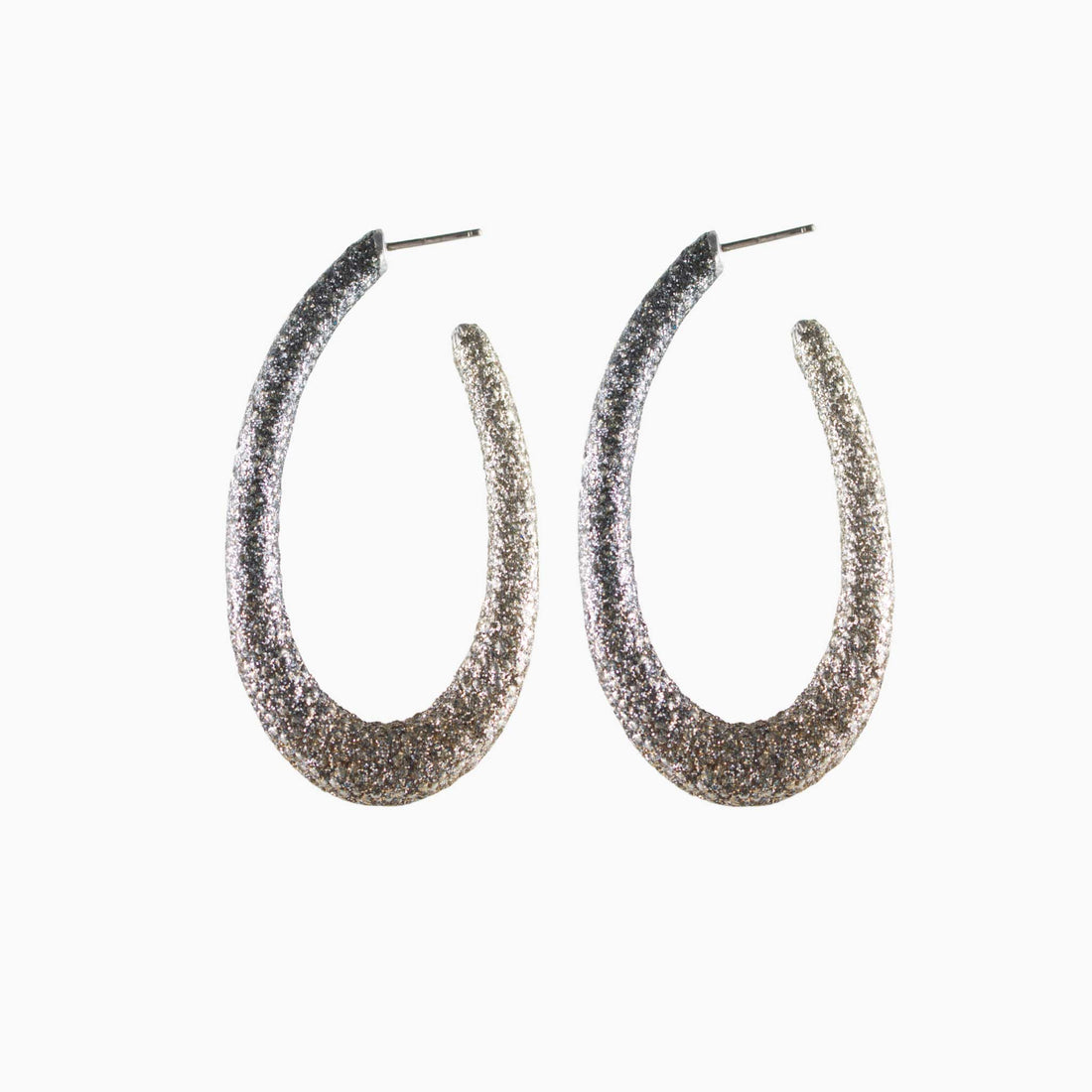Pair of glittery hoop earrings on a white background