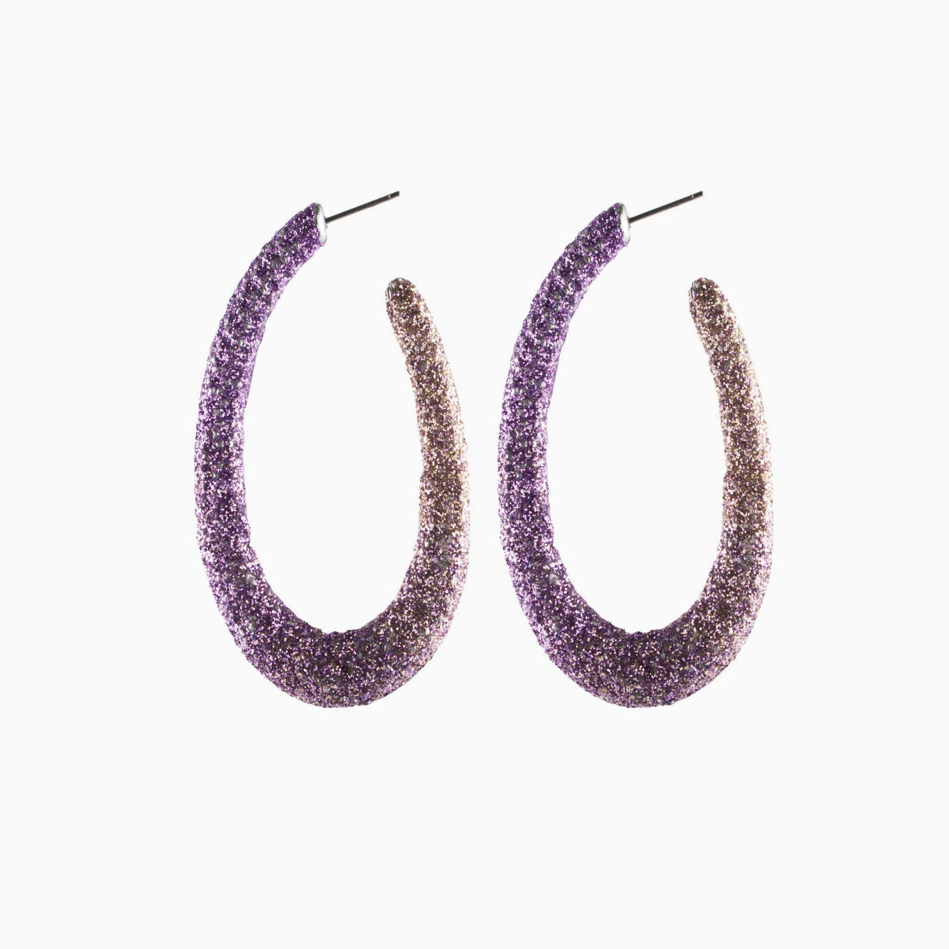 Pair of gradient purple and gold hoop earrings on a white background