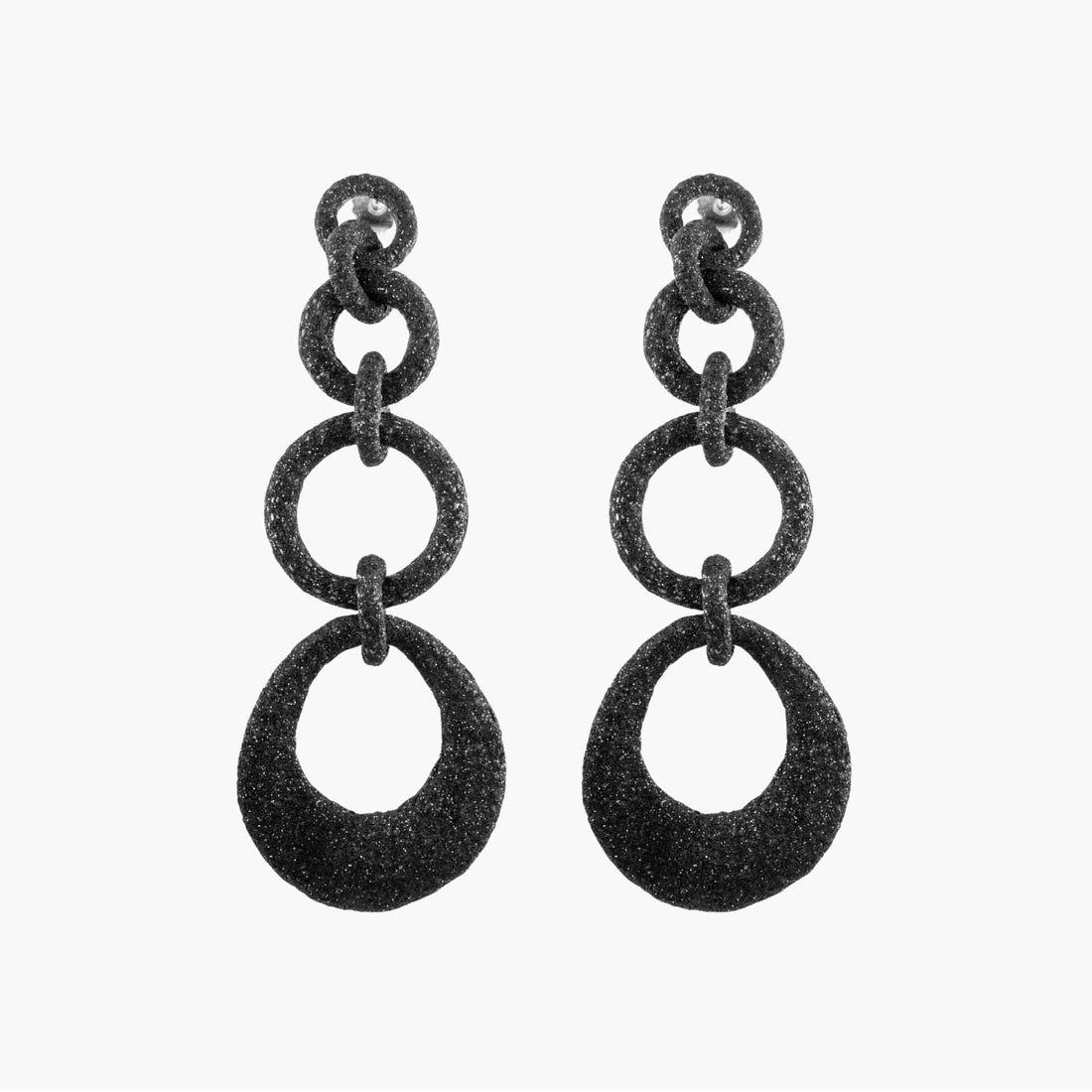 Pair of black chain-style earrings on a white background