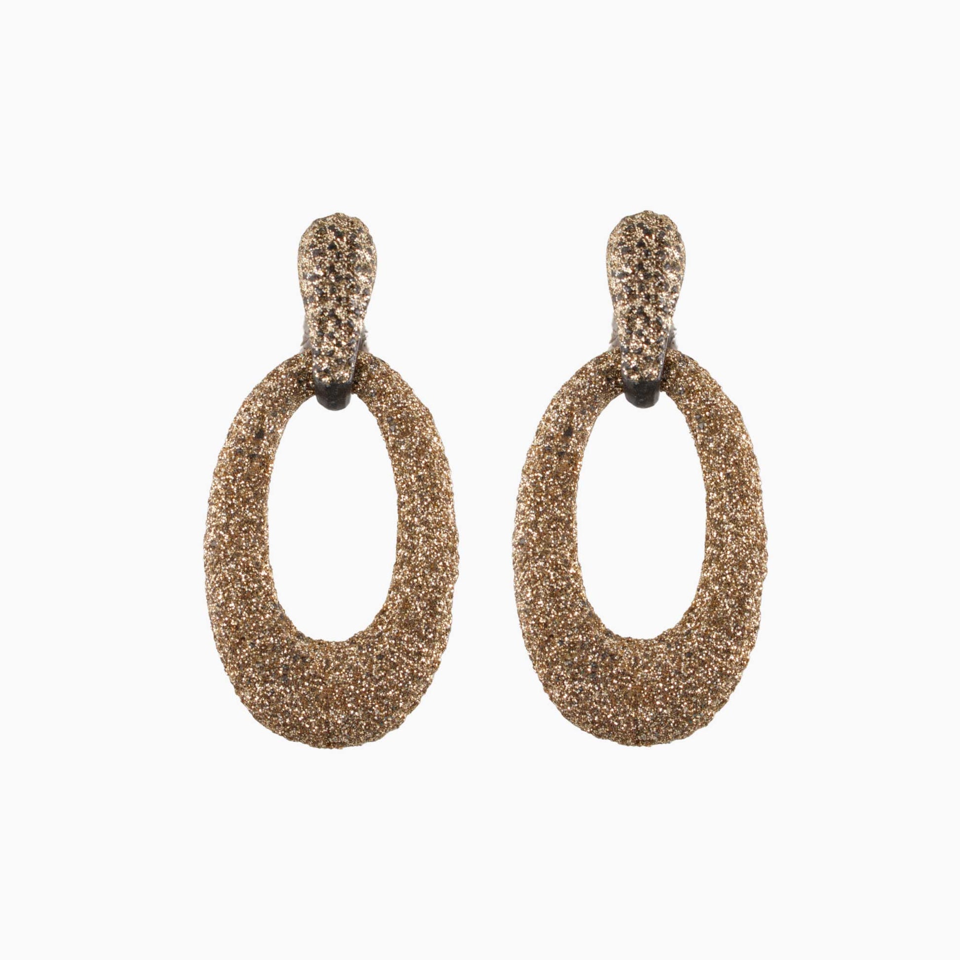 Pair of gold hoop earrings on a white background