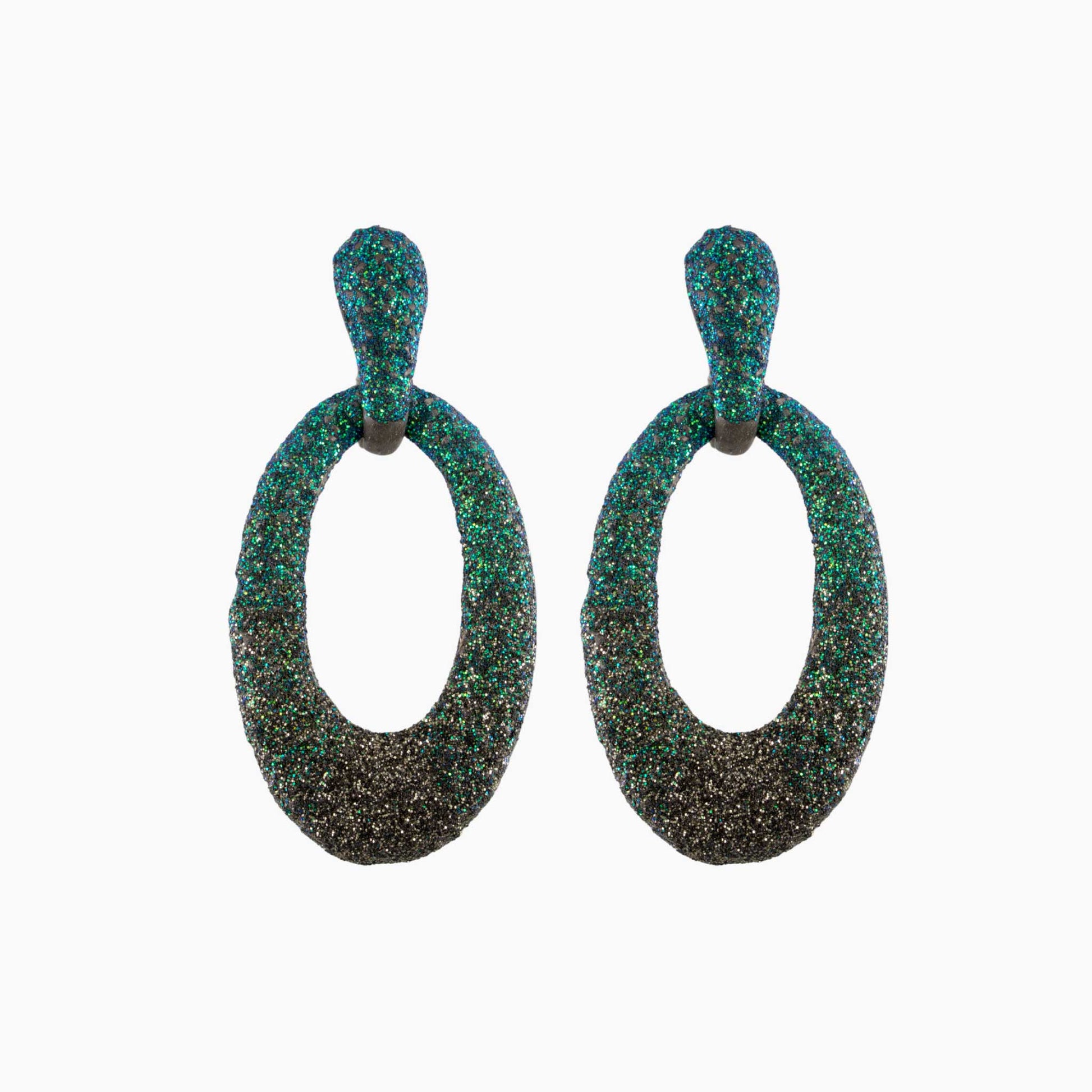 Pair of green and black textured earrings on a white background