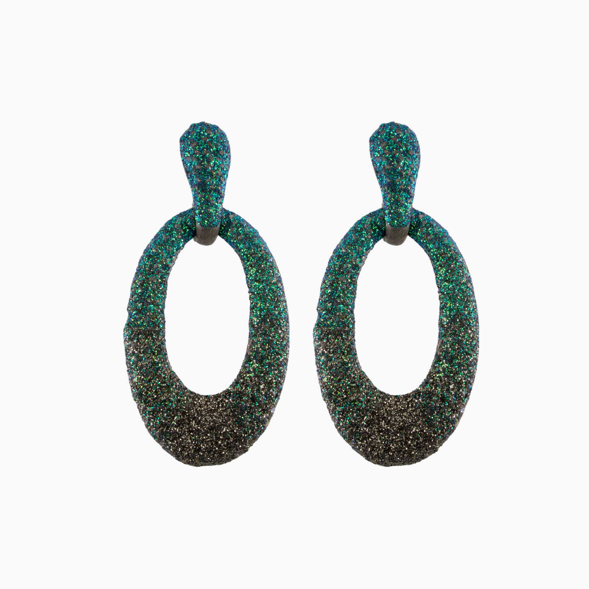 Pair of green and black textured earrings on a white background
