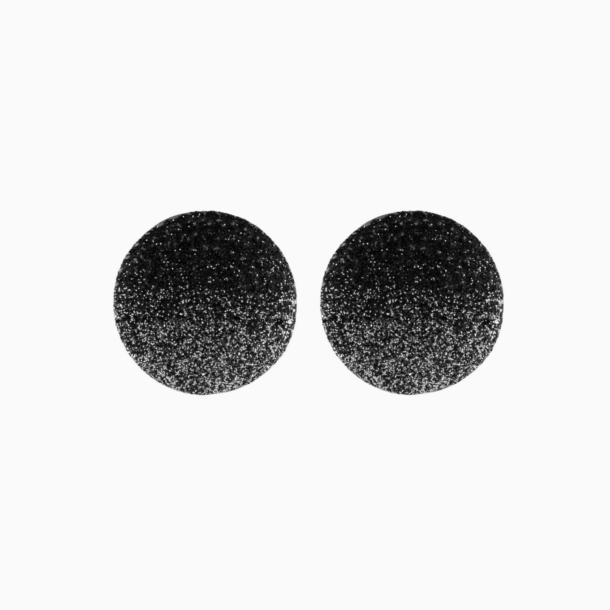 Black glittery round earrings on a white background