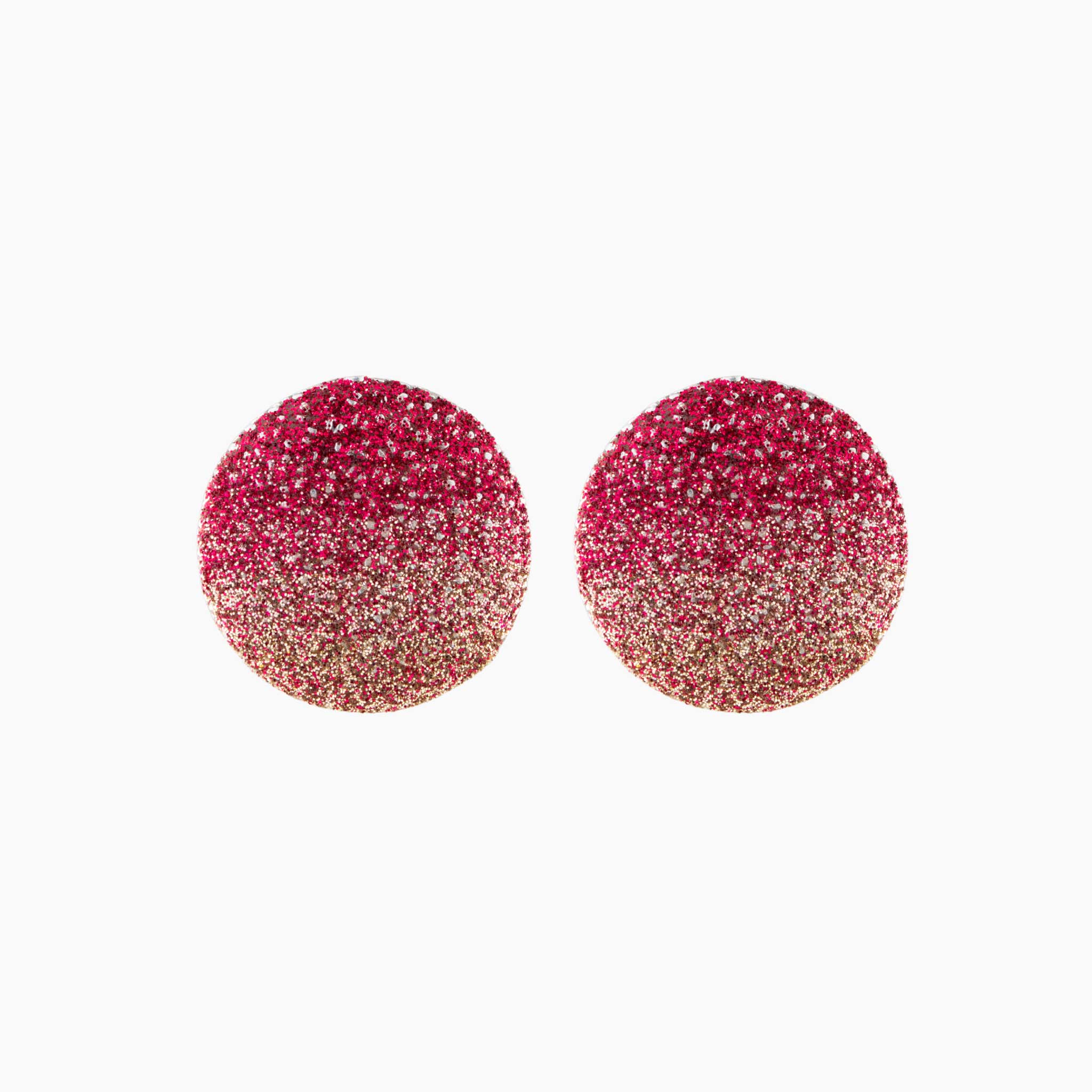 Pair of red glittery round earrings on a white background