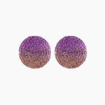 Purple and gold glittery round earrings on a white background