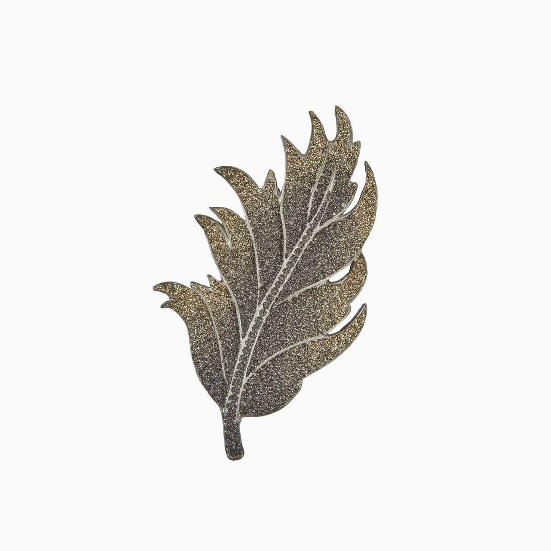 Decorative leaf-shaped brooch on a white background