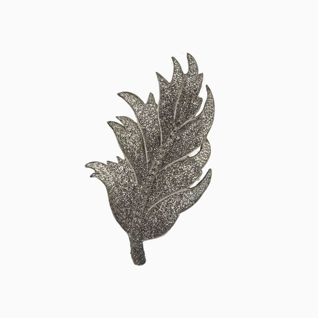 Decorative leaf-shaped brooch on a white background
