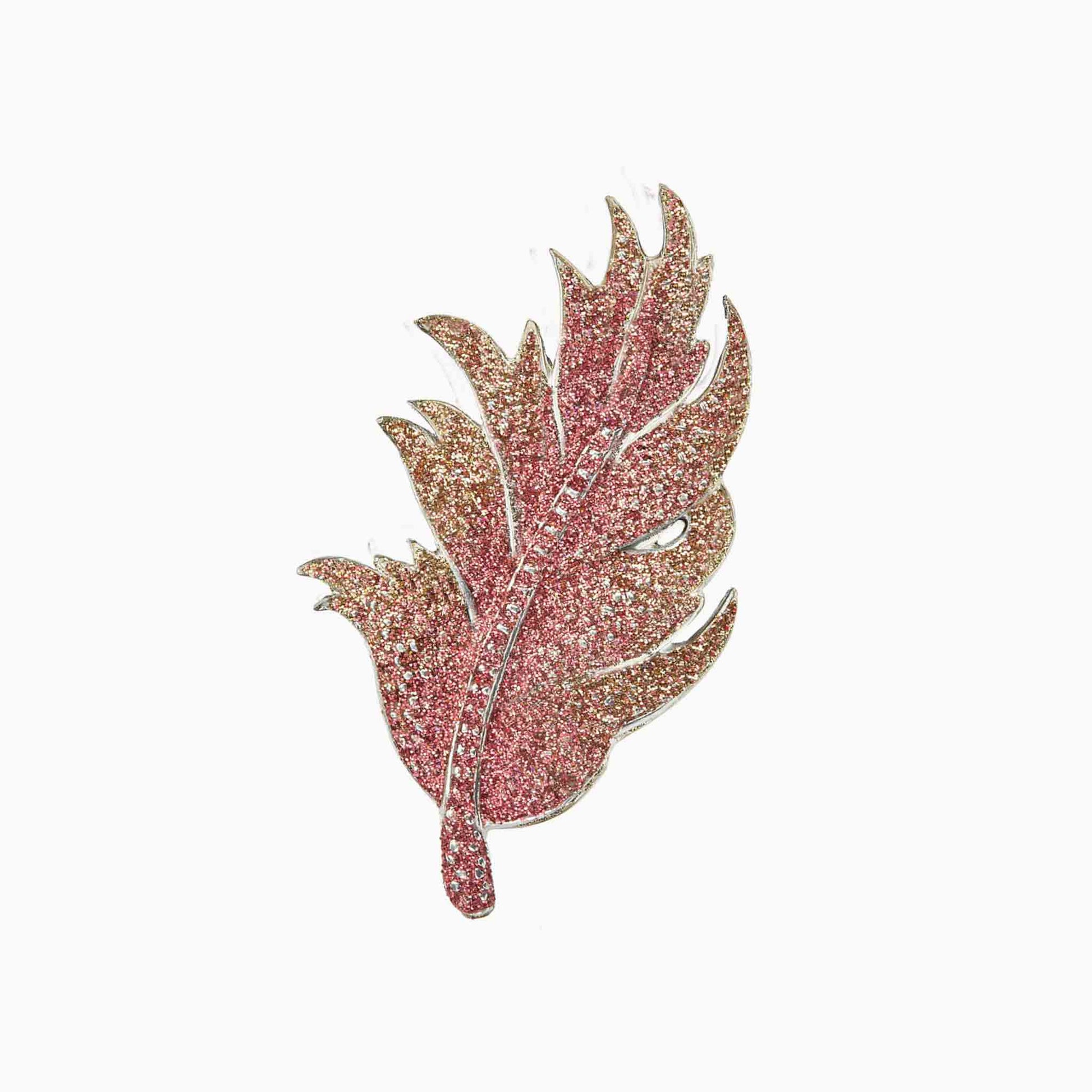 Decorative leaf-shaped brooch on a white background