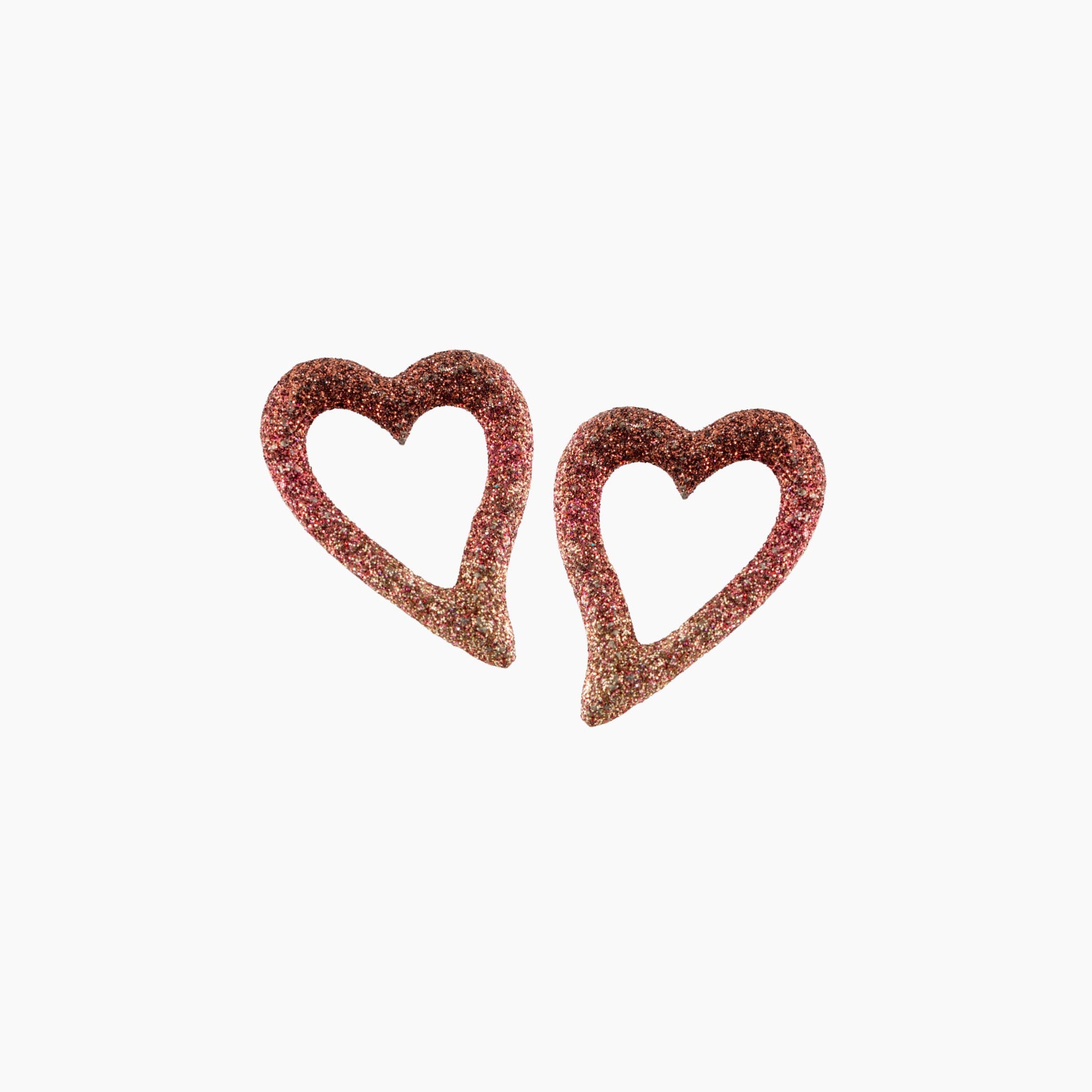 Pair of heart-shaped earrings with glittery texture on a white background