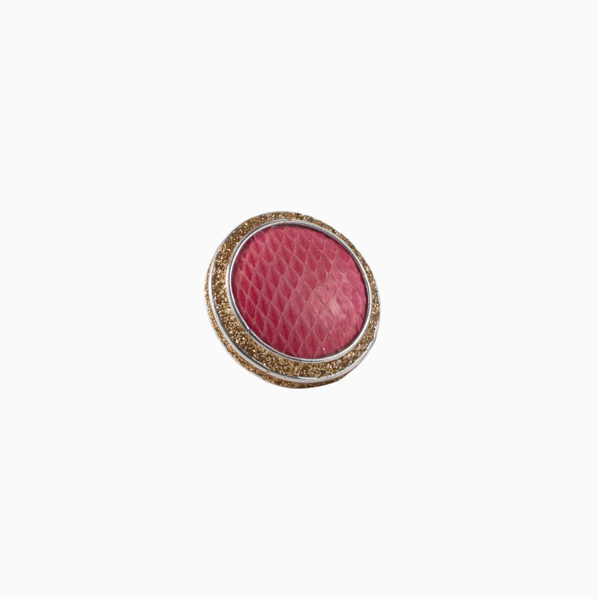 Pink textured round ring with gold border on a white background