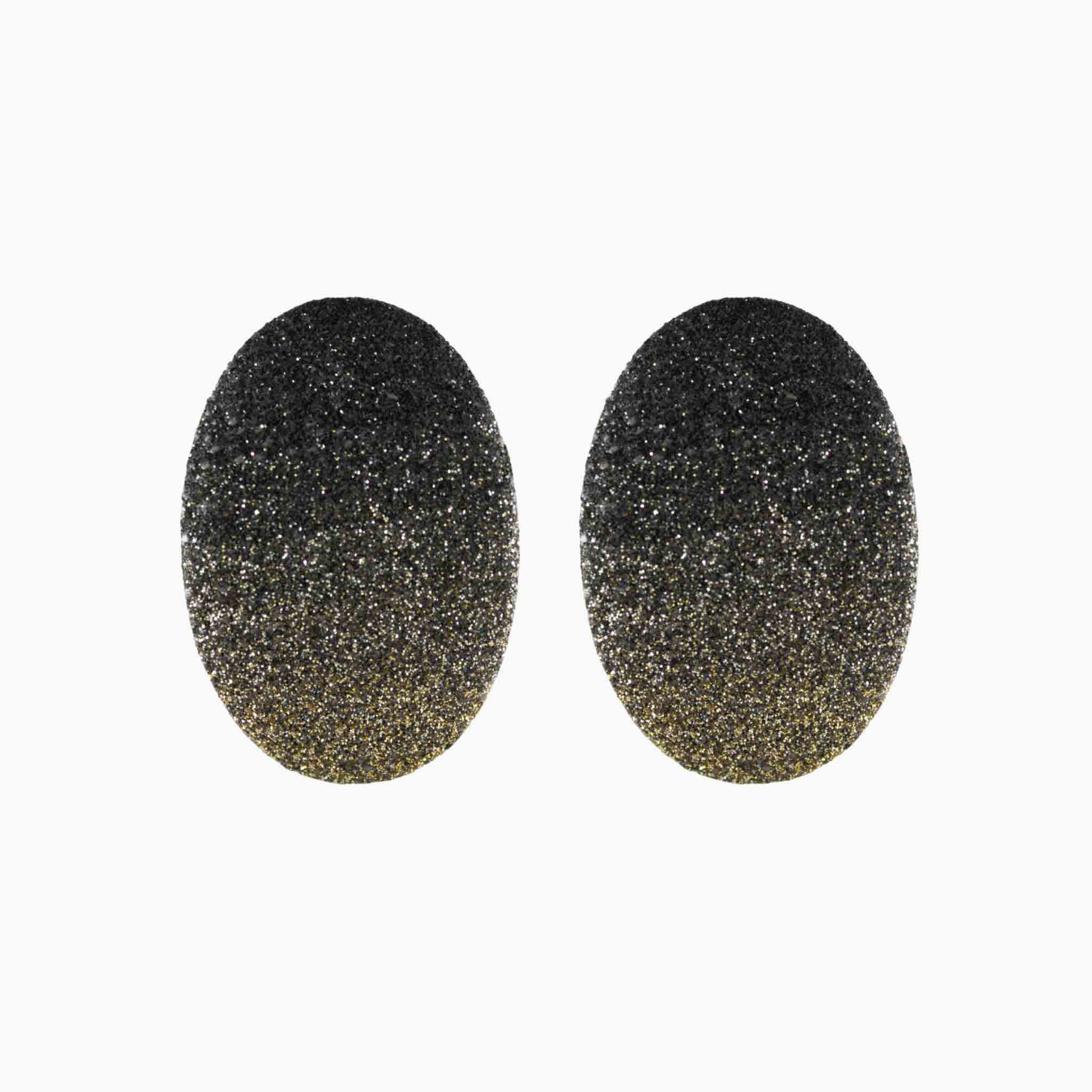 Pair of black glittery oval-shaped earrings on a white background