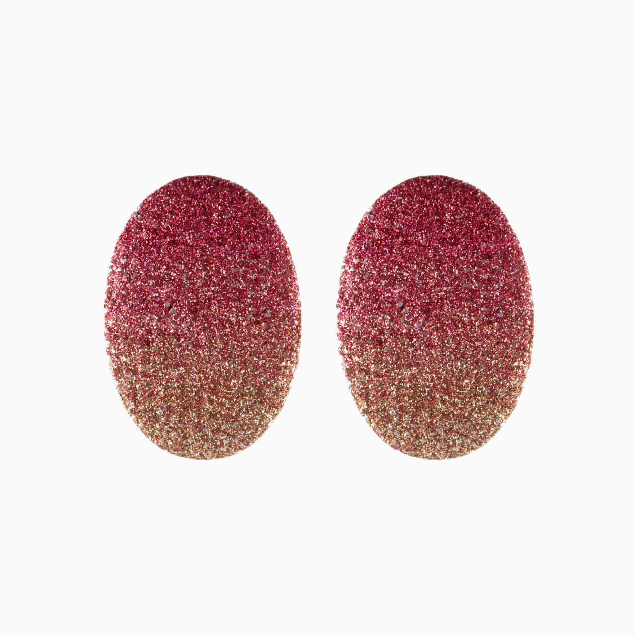 Pair of glittery pink and gold earrings on a white background