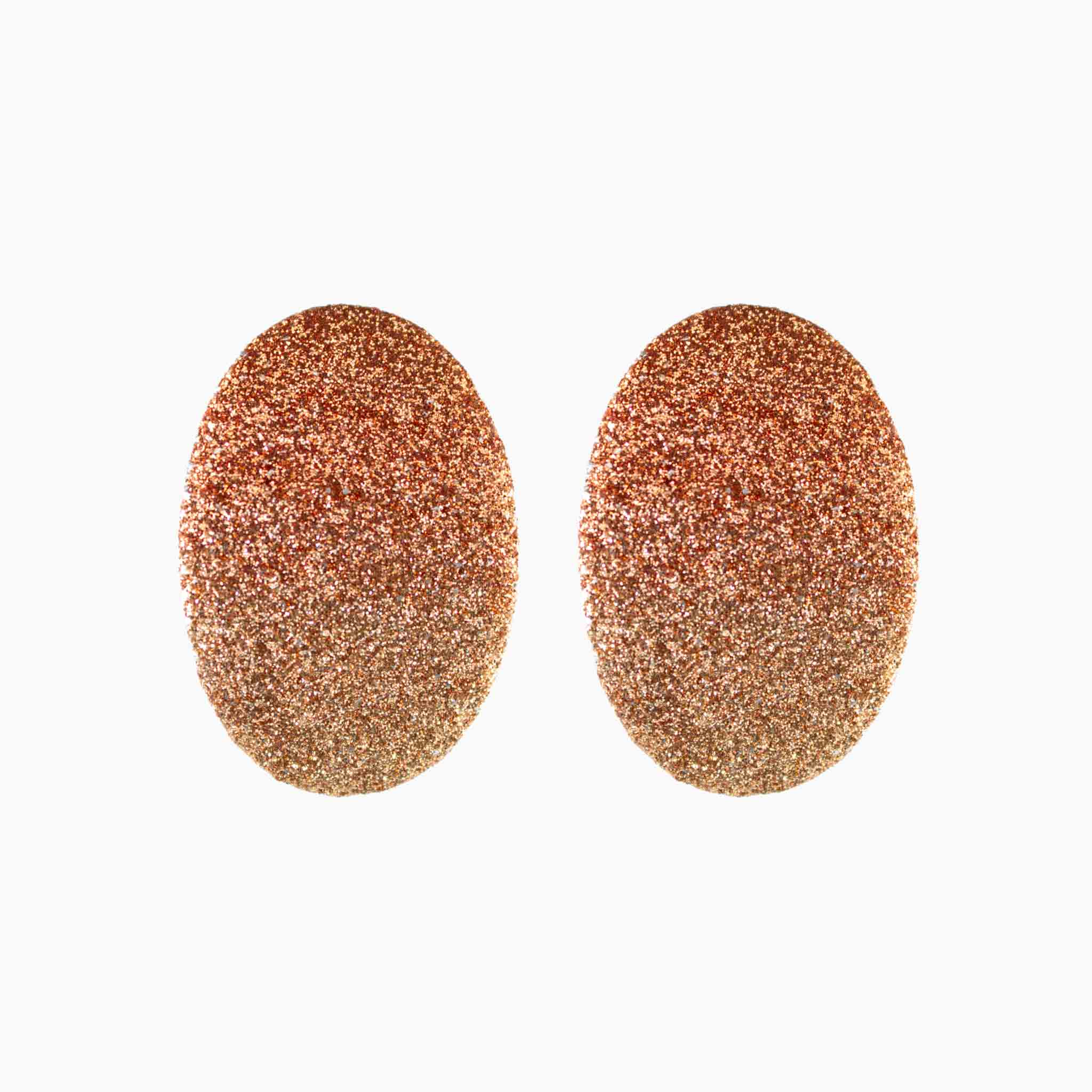 Pair of rose gold glittery oval earrings on a white background
