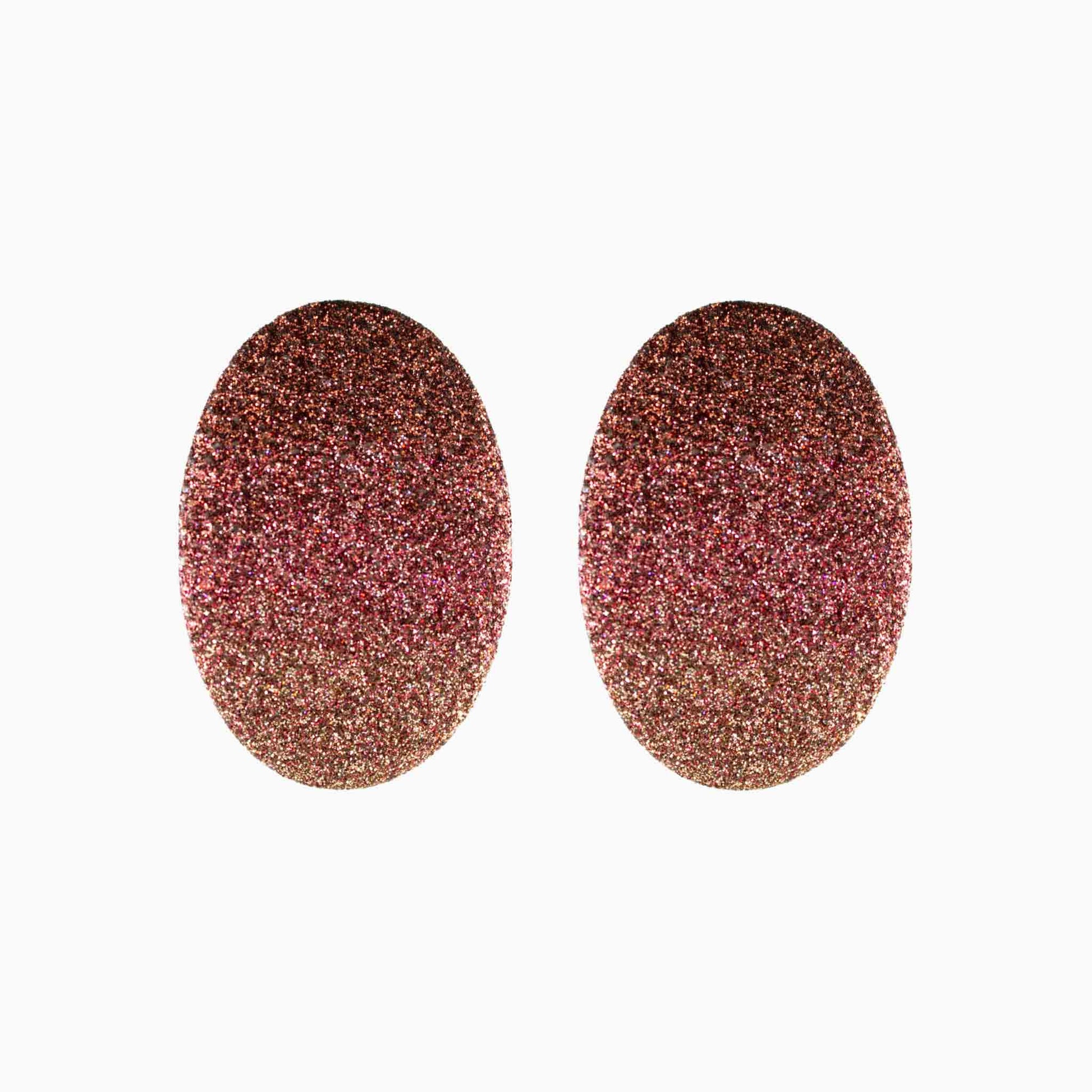 Pair of glittery oval-shaped earrings on a white background