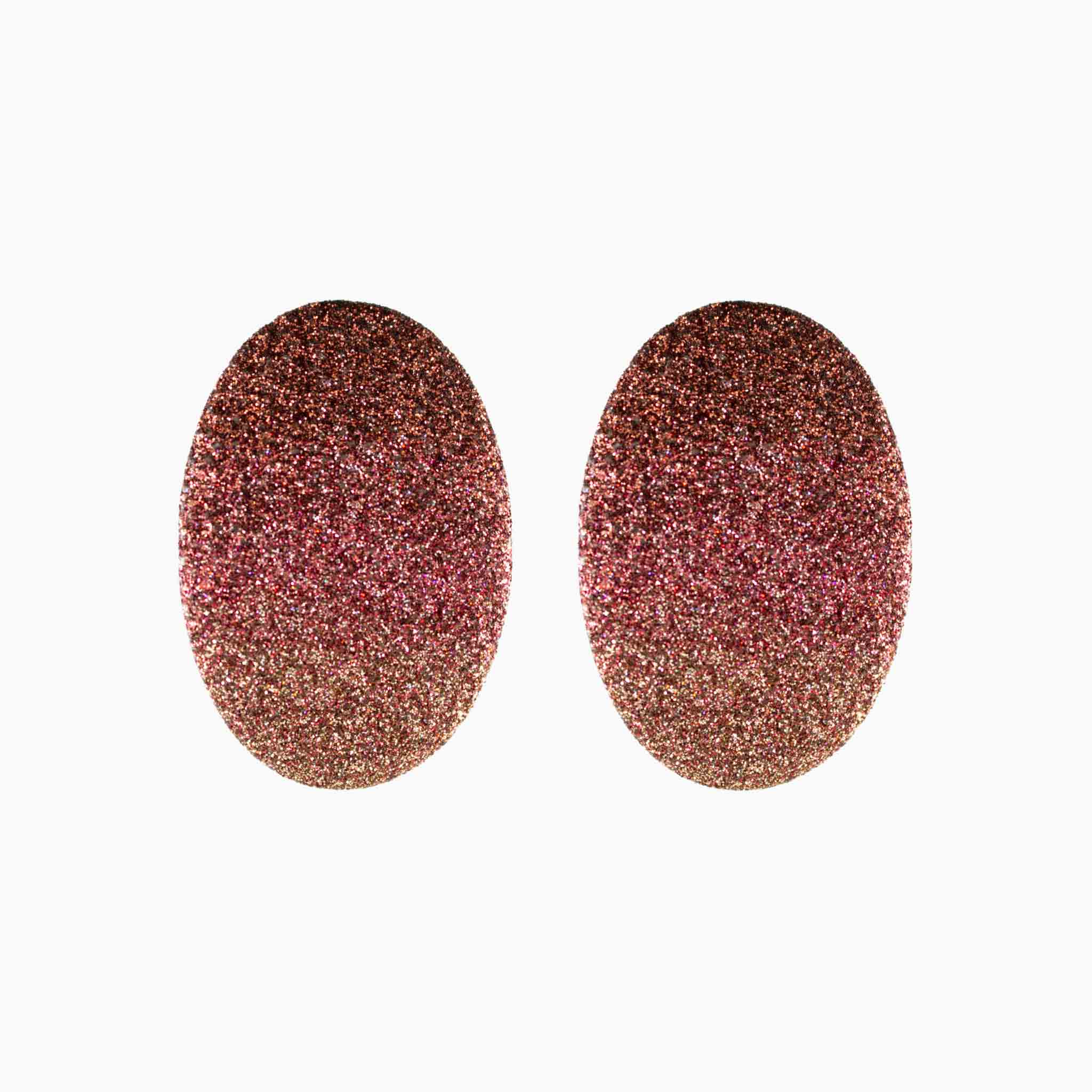 Pair of glittery oval-shaped earrings on a white background