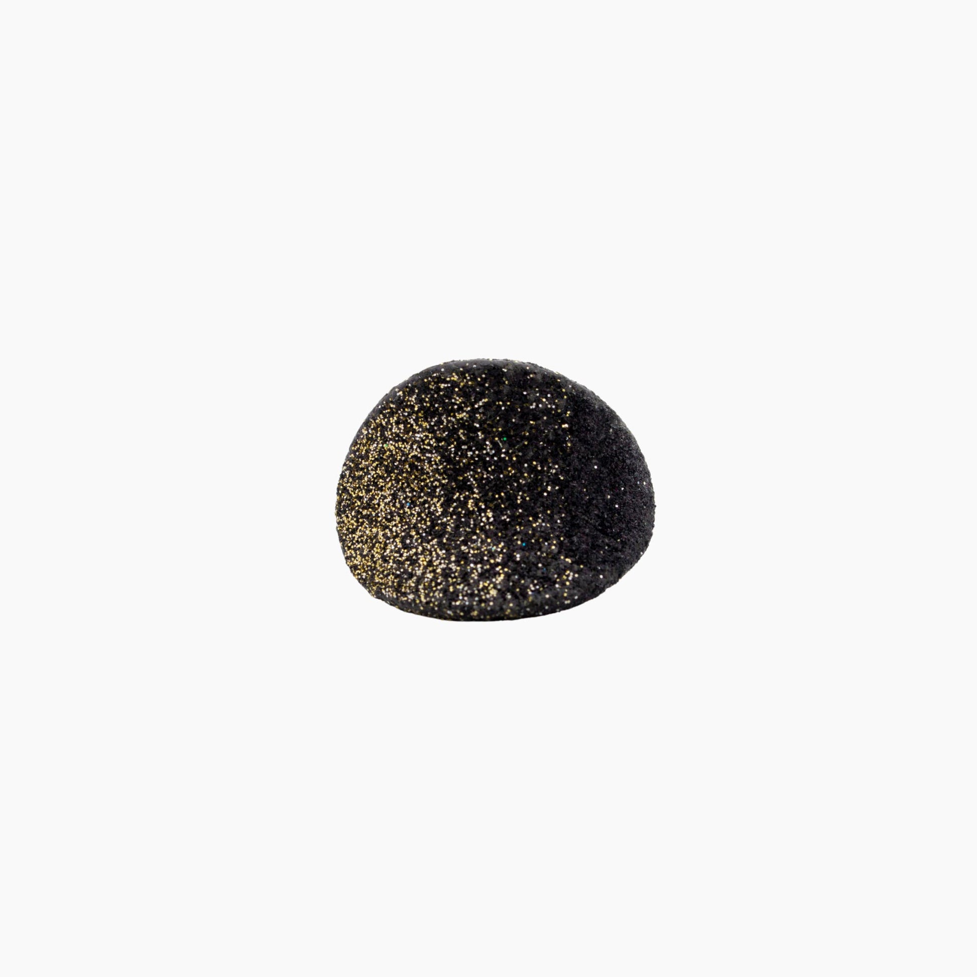 Black ring with gold speckles on a white background