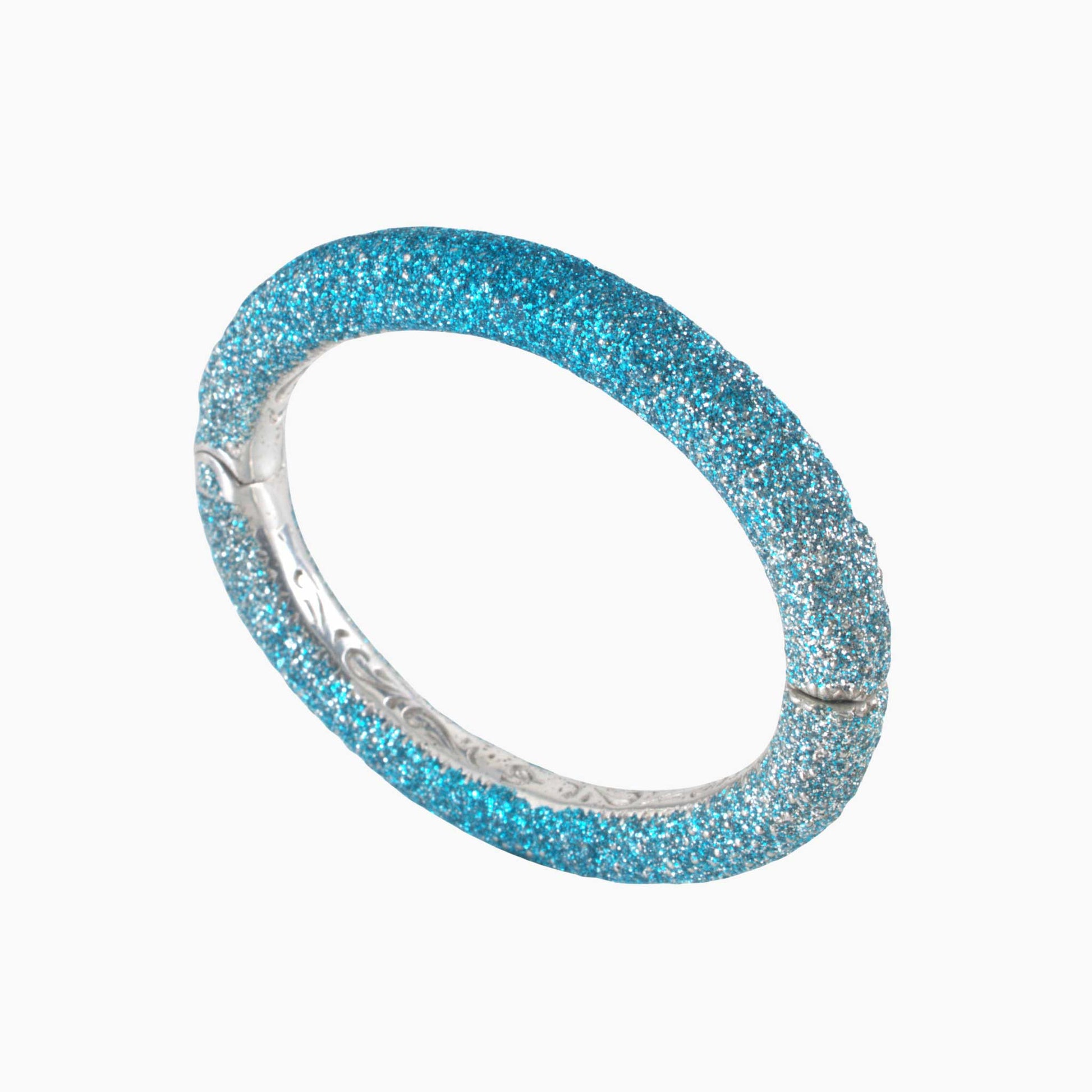 Blue glittery bracelet on a white background