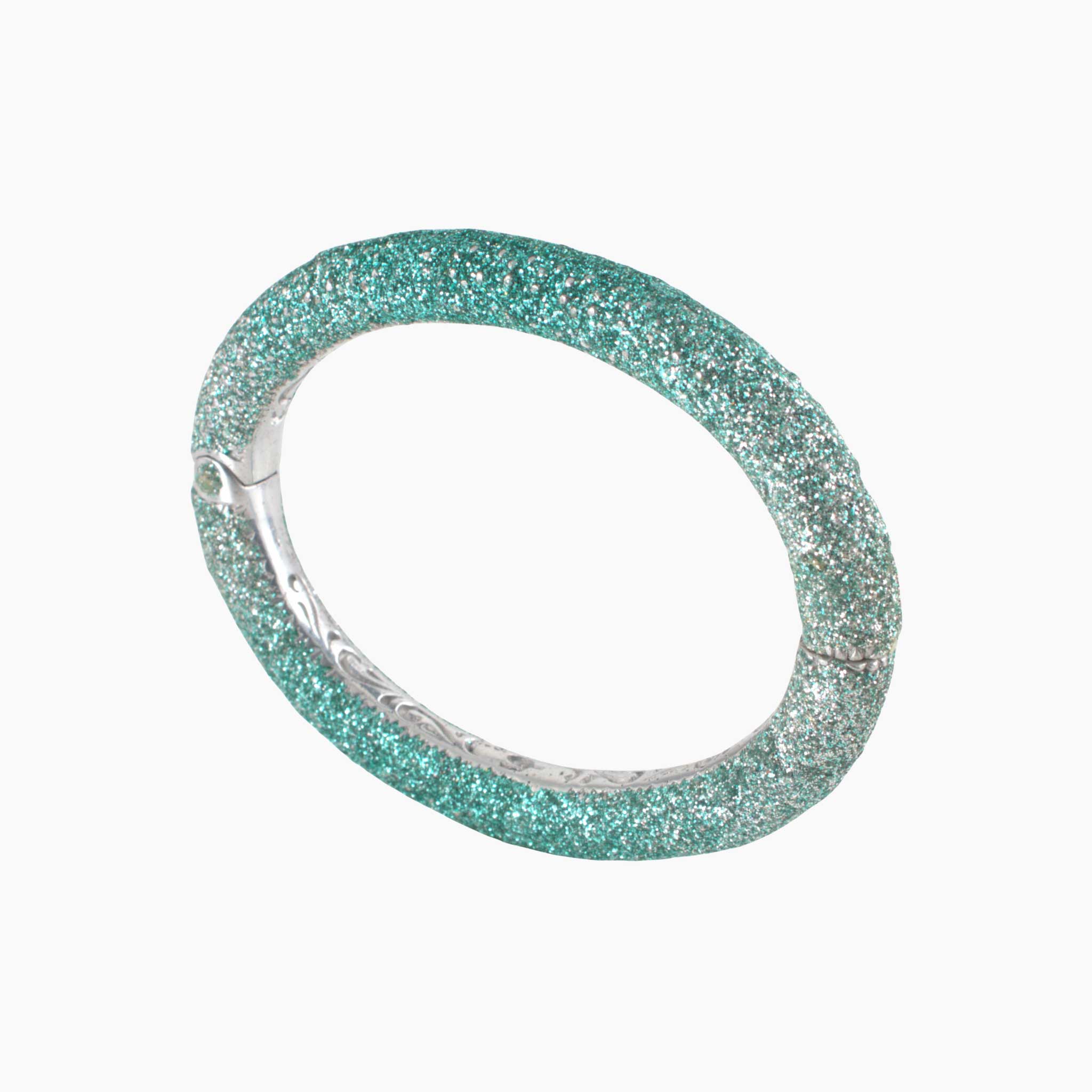 Turquoise glittery bracelet on a white background