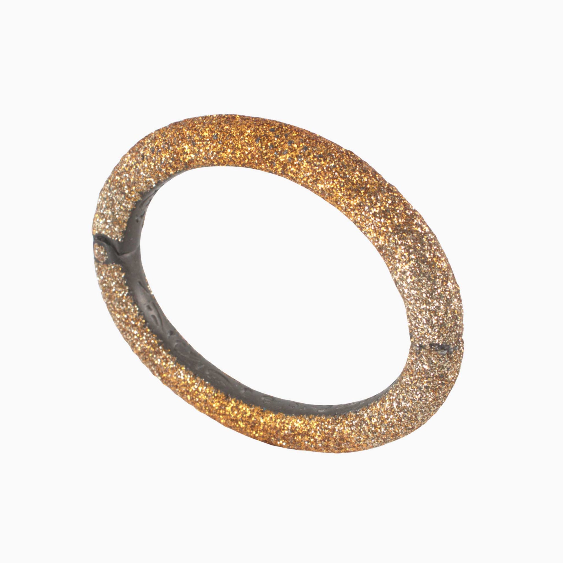 Gold glittery bracelet on a white background
