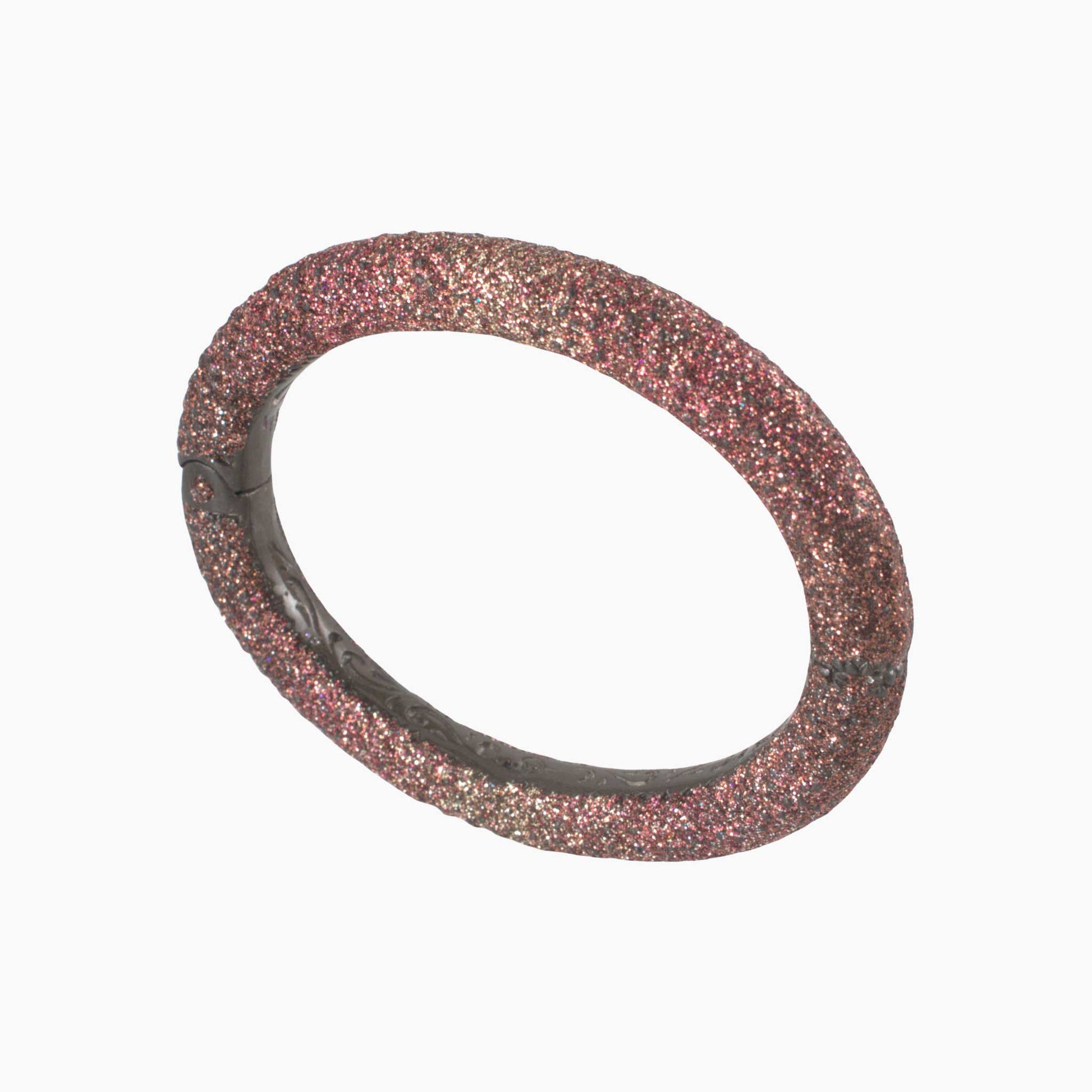 Pink glittery bracelet on a white background