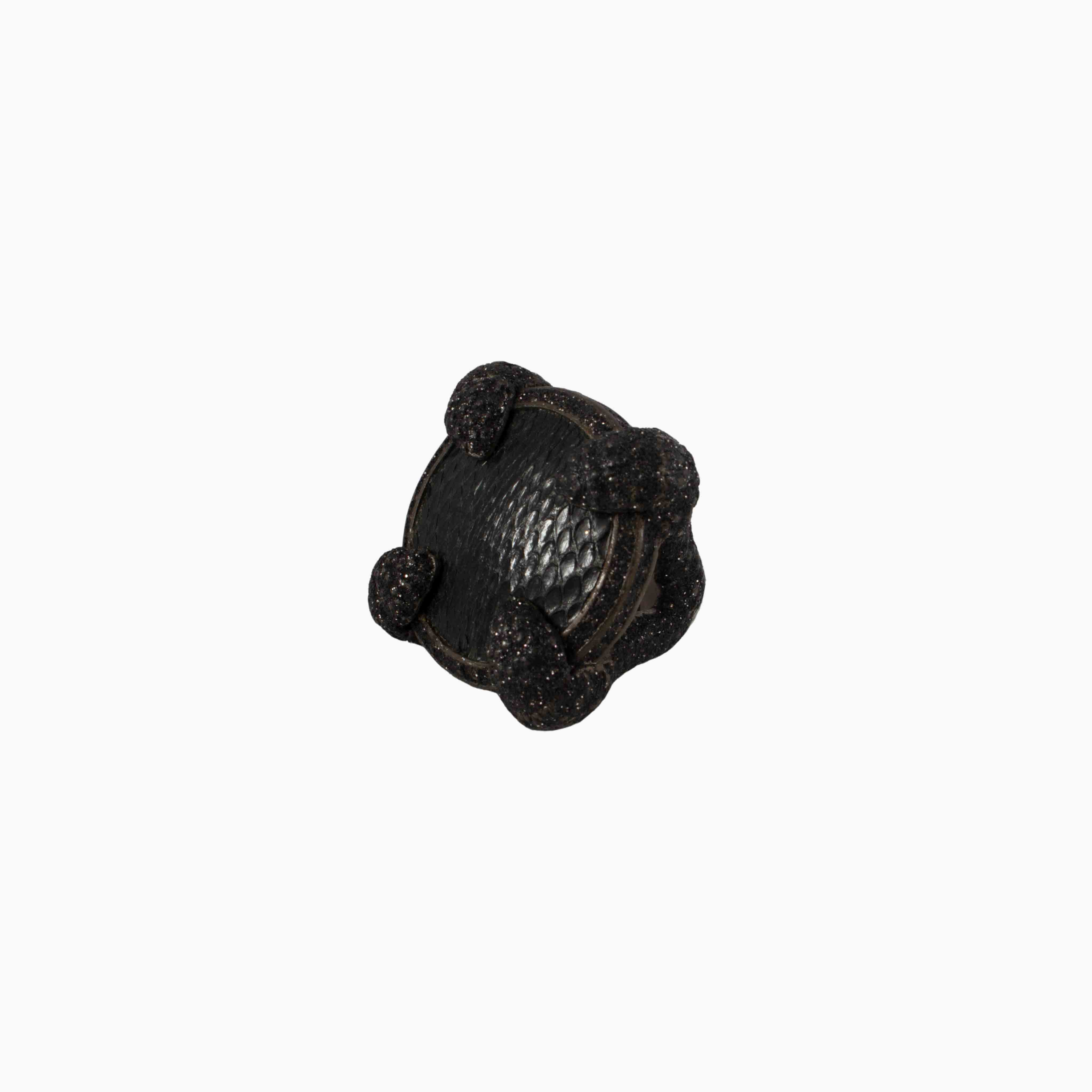 Decorative black knob on a white background