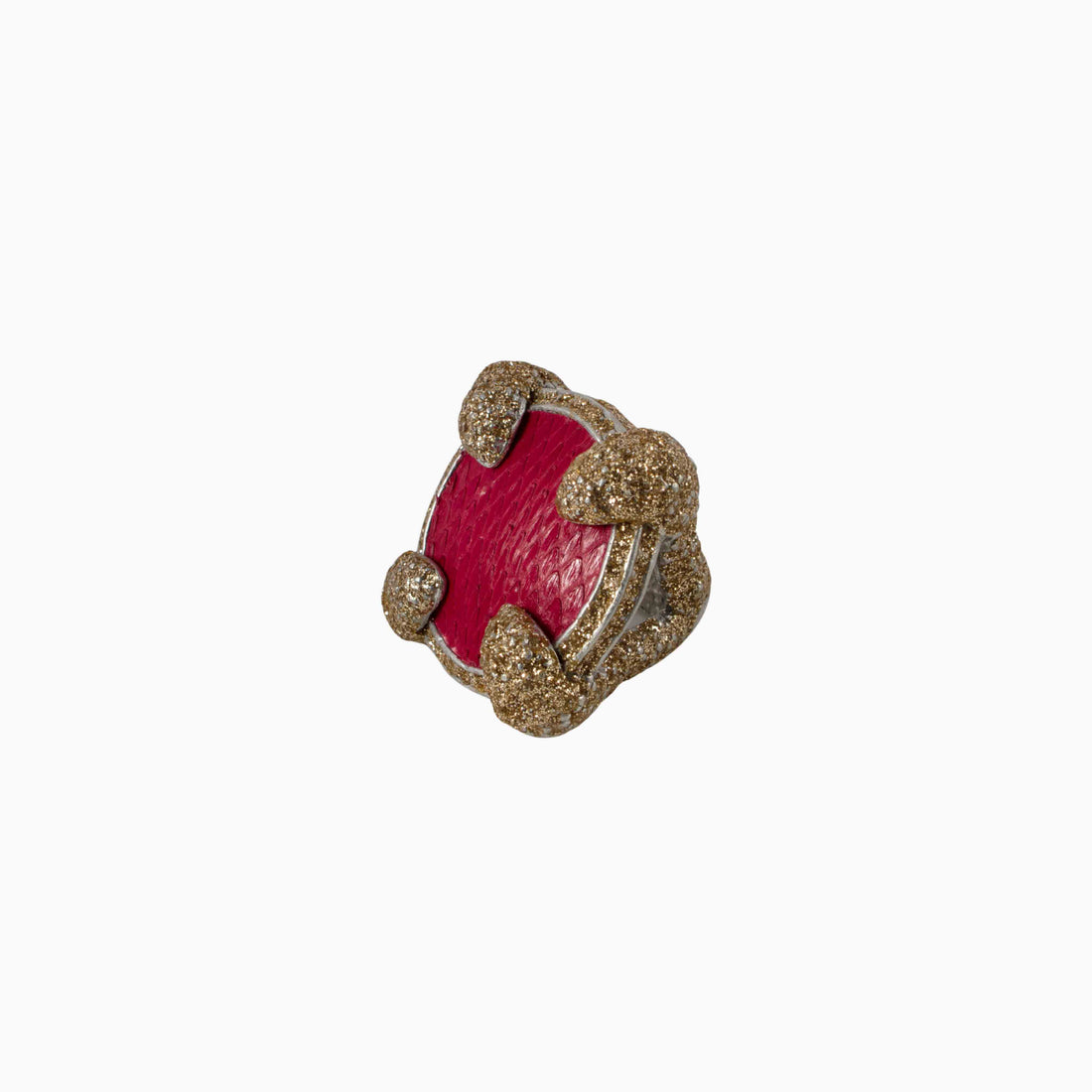 Decorative item with red center and gold glittery frame on a white background