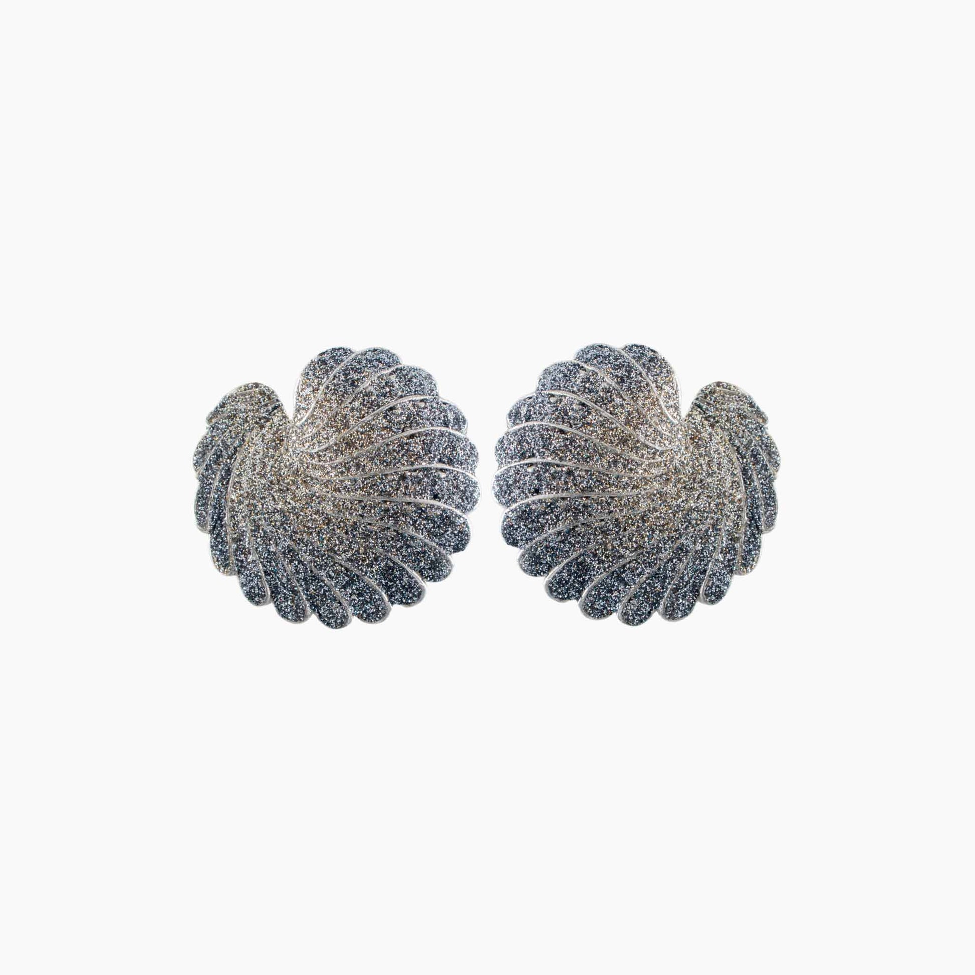 Pair of silver leaf-shaped earrings on a white background