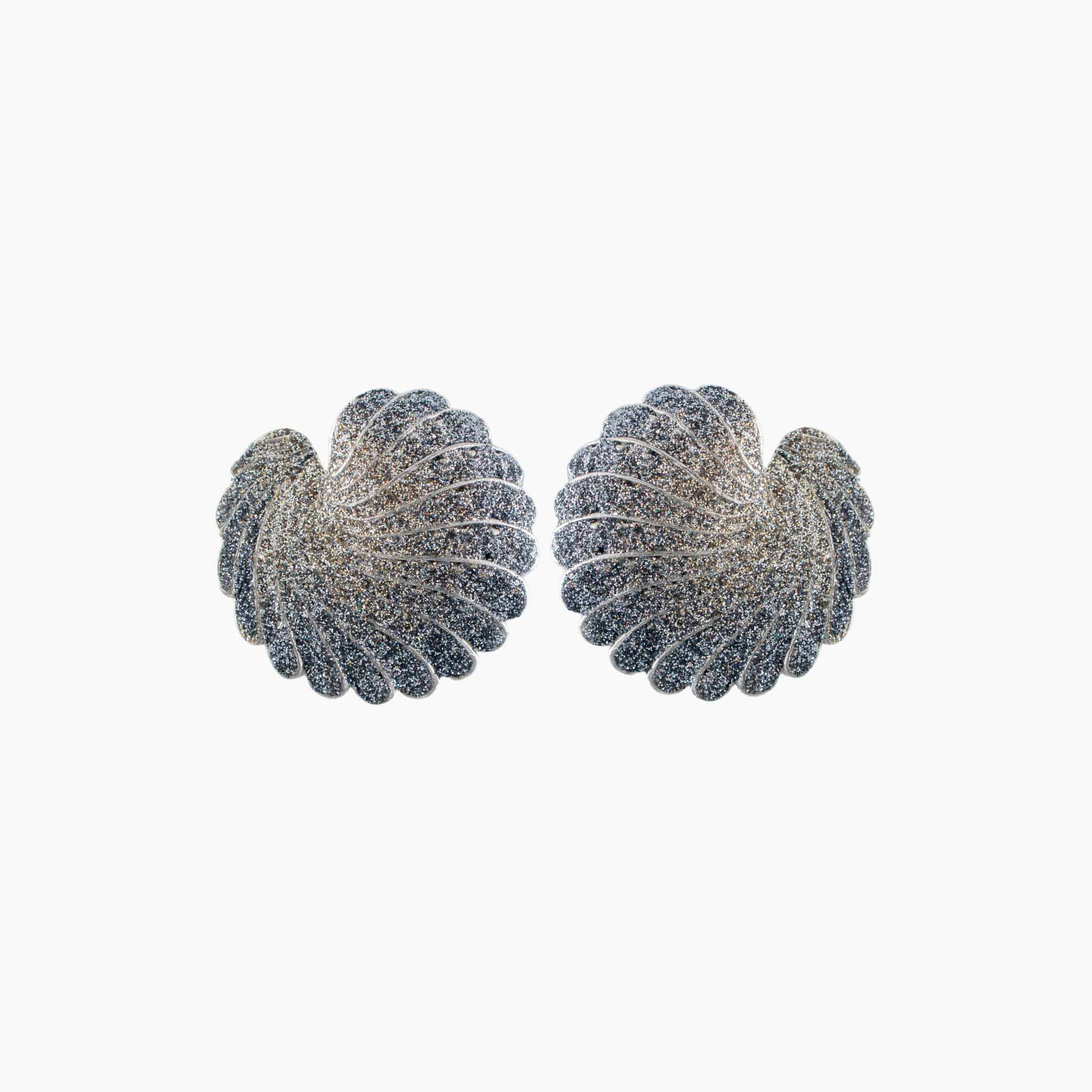 Pair of silver leaf-shaped earrings on a white background