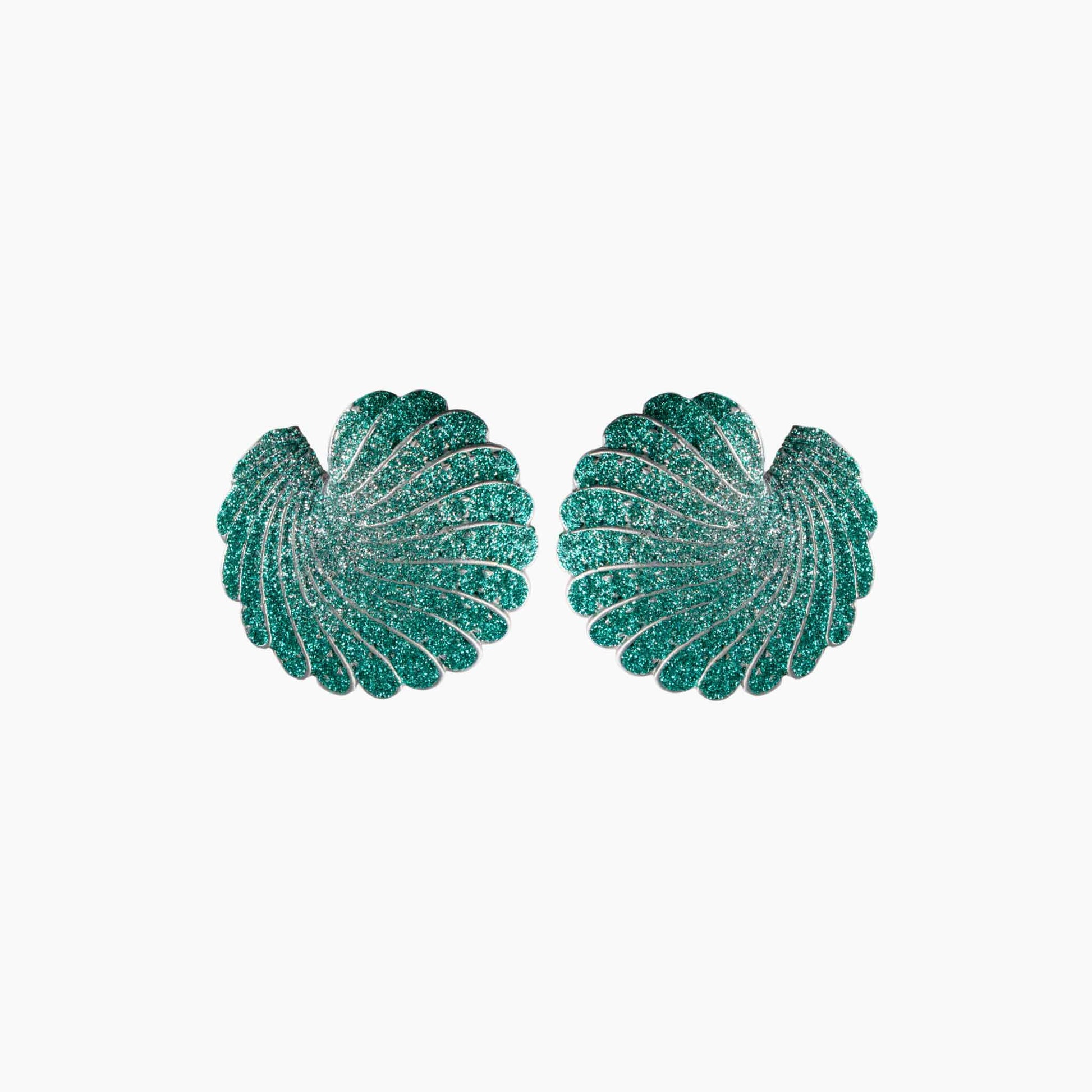 Pair of green shell-shaped earrings on a white background