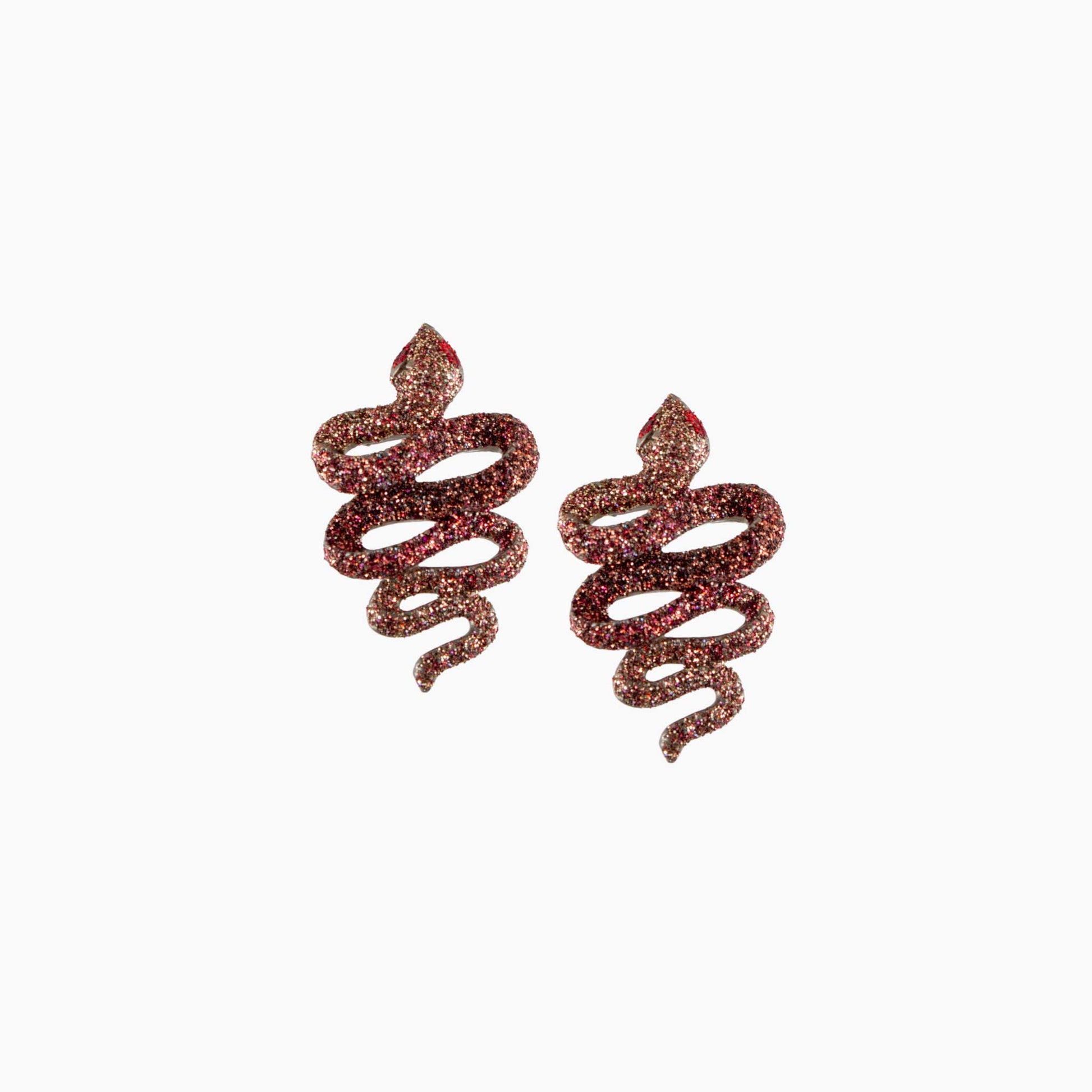 Pair of spiral-shaped earrings with glittery texture on a white background