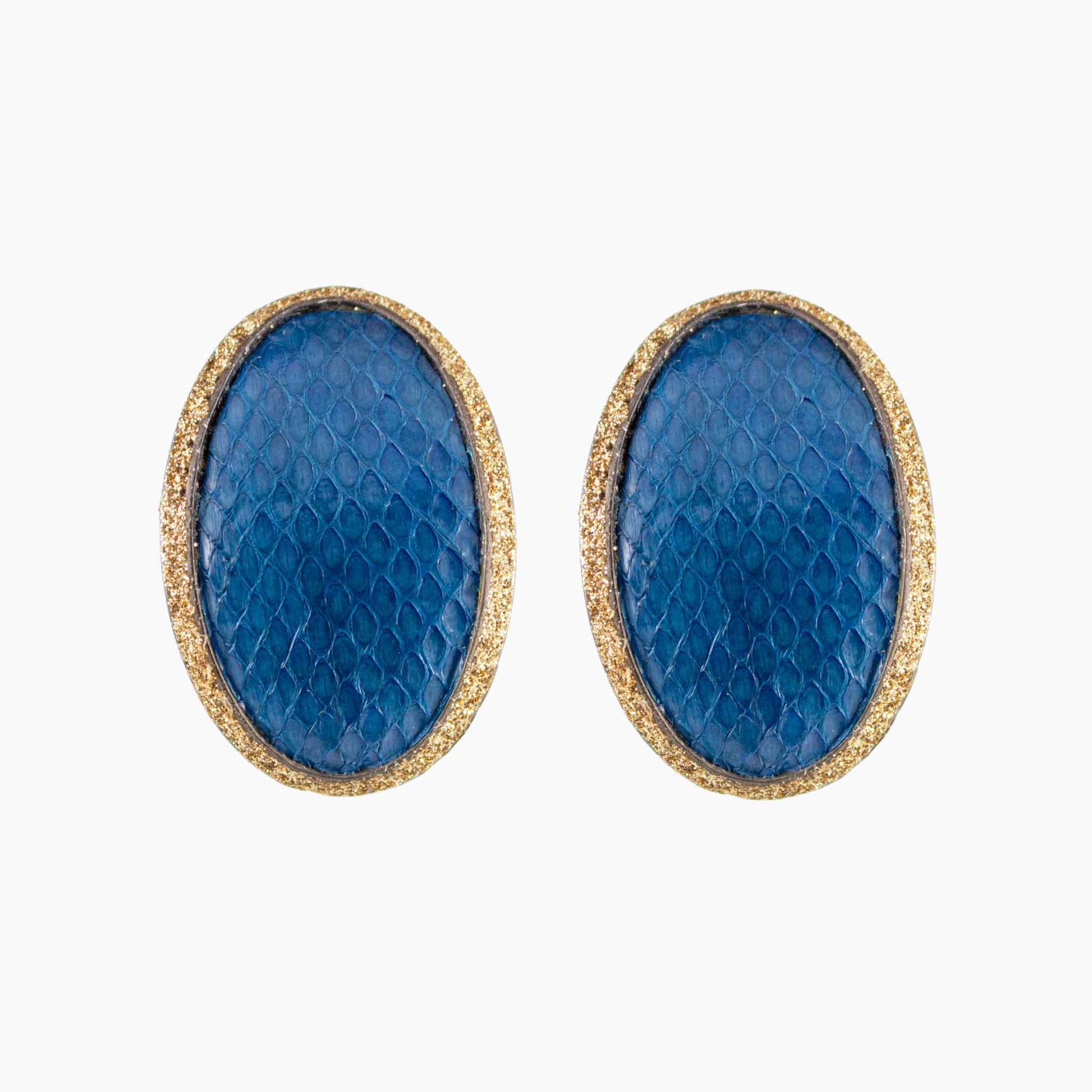 Pair of blue oval earrings with gold accents on a white background