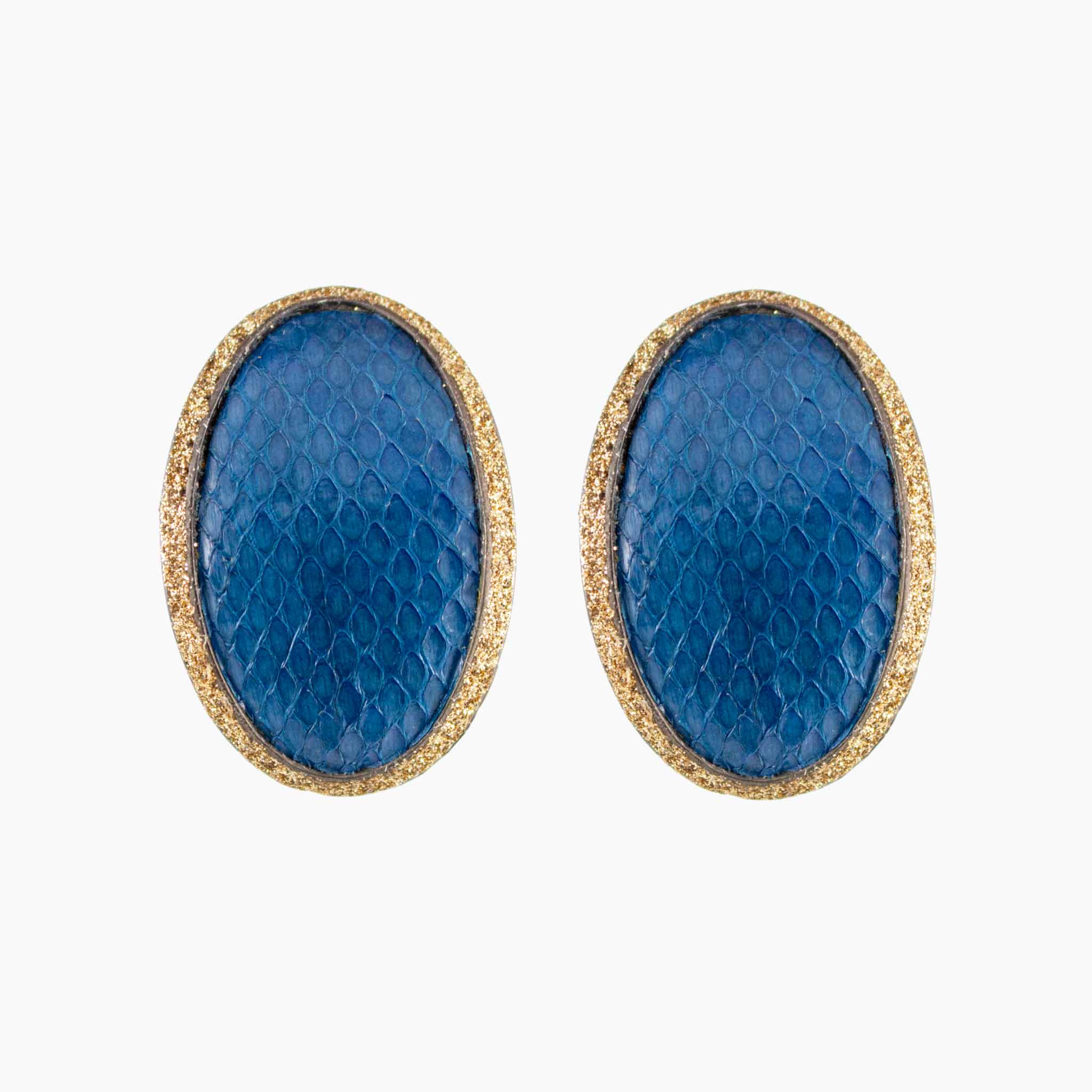 Pair of blue oval earrings with gold accents on a white background