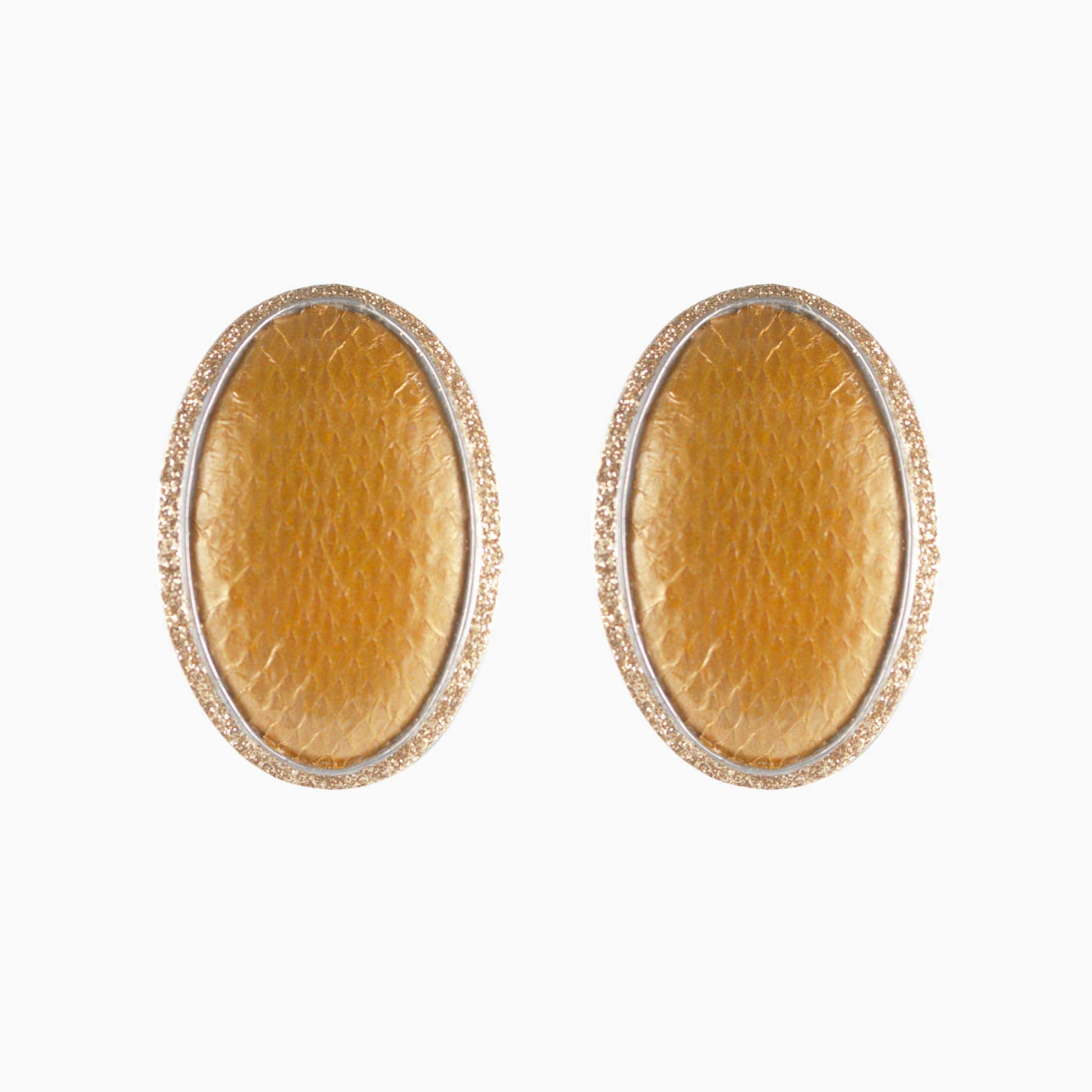 Pair of gold oval earrings on a white background