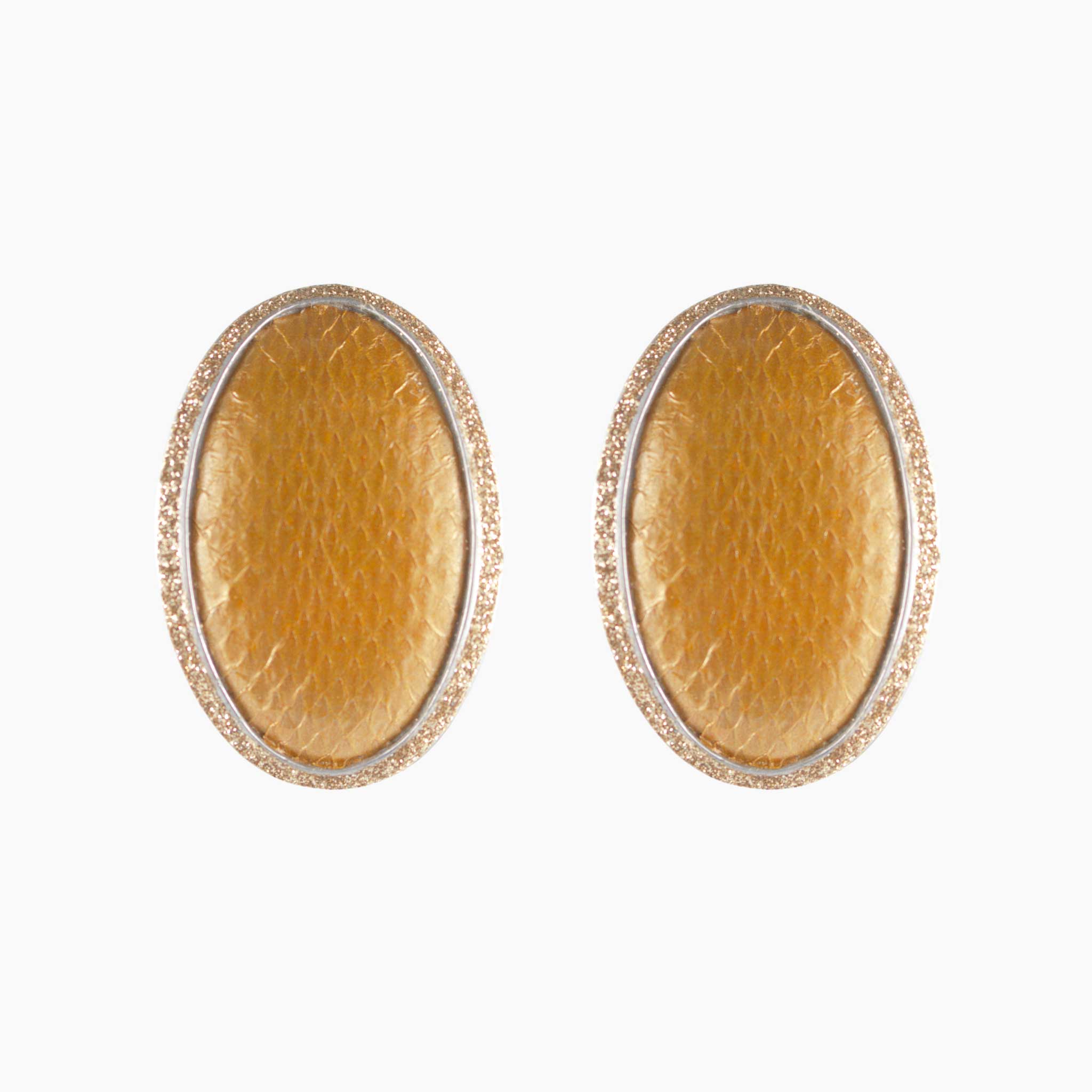 Pair of gold oval earrings on a white background