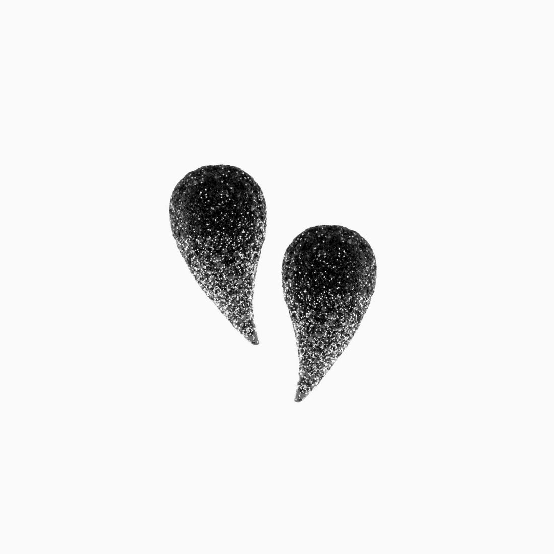 Blue glittery teardrop-shaped earrings on a white background