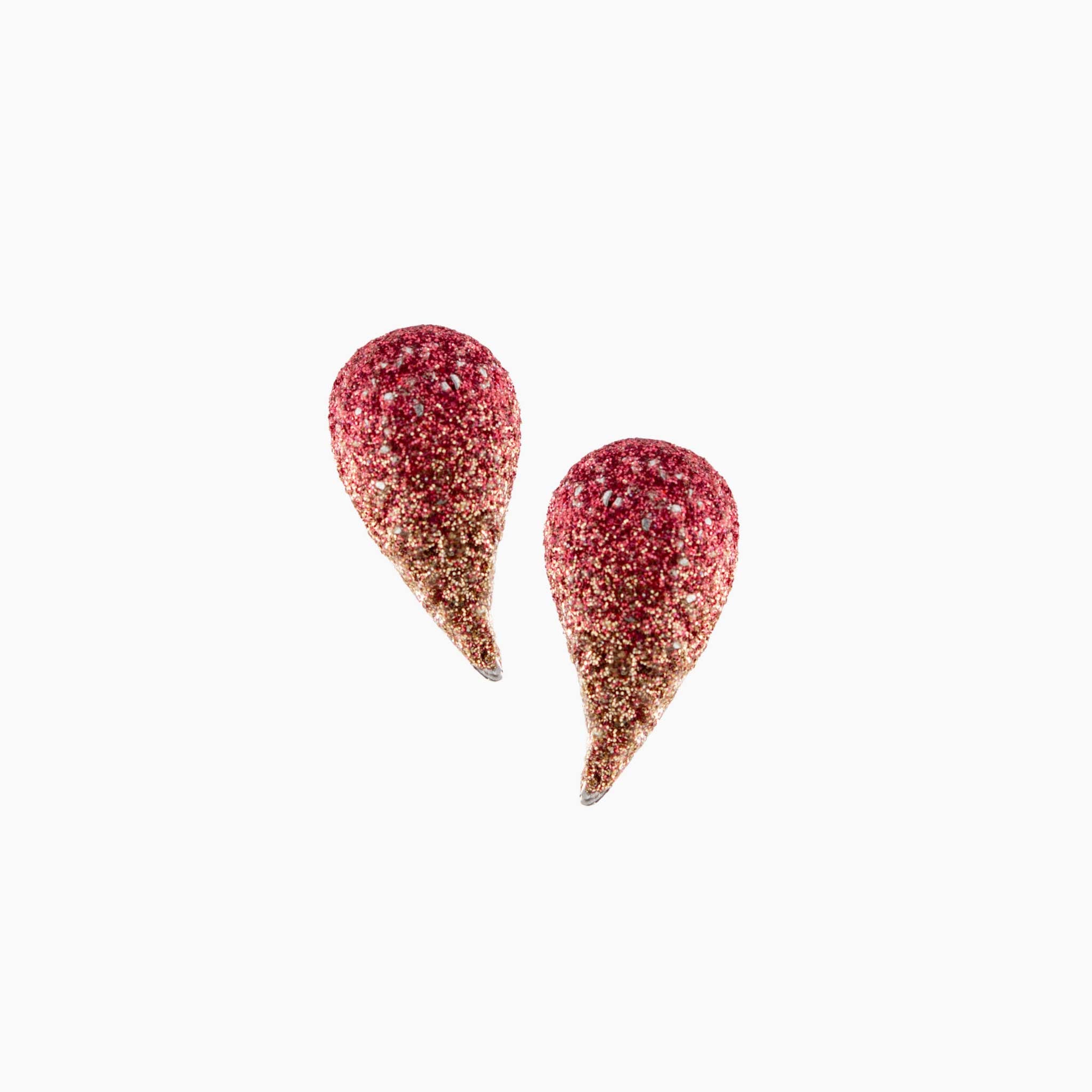 Pair of red and gold teardrop-shaped earrings on a white background