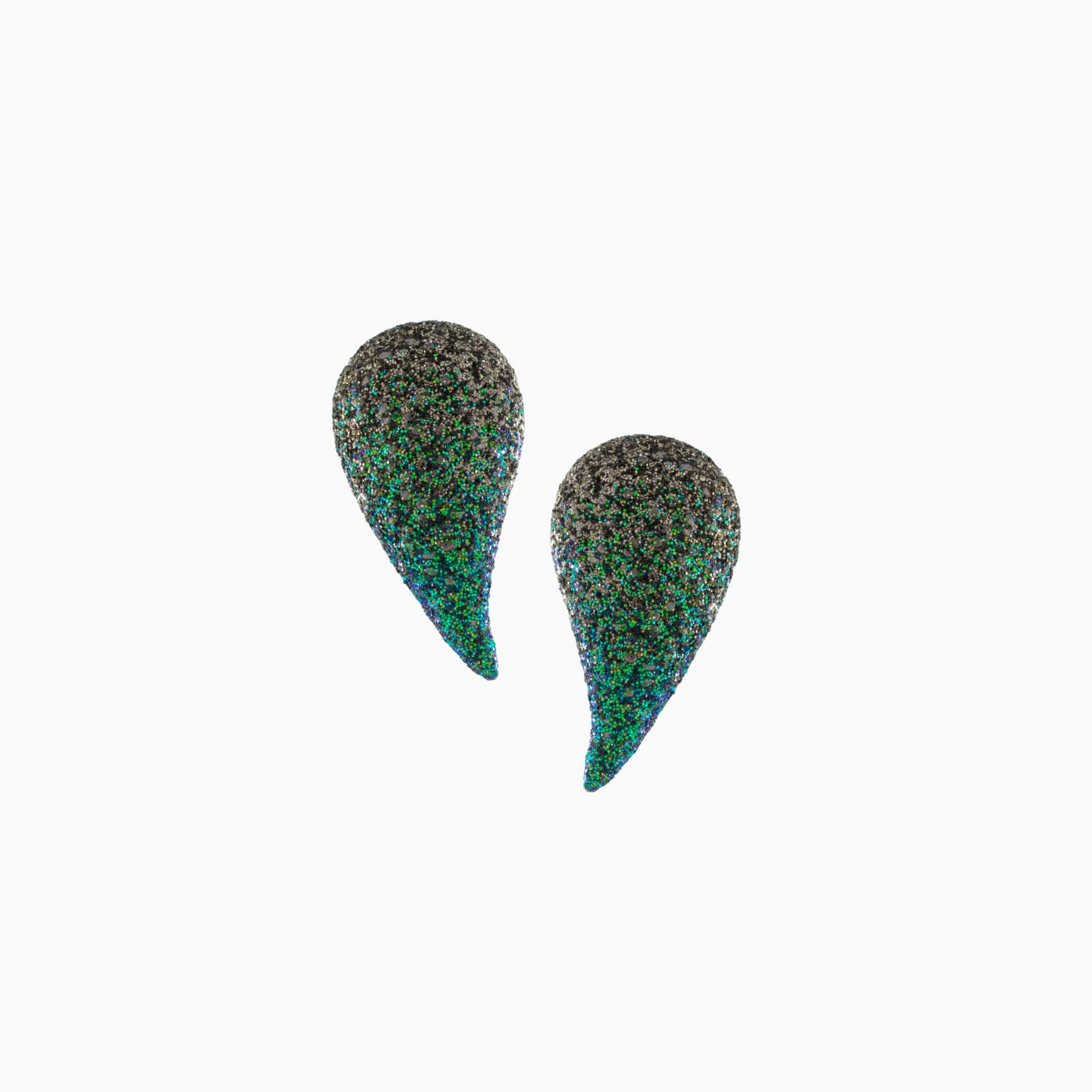 Teardrop-shaped earrings with a speckled pattern on a white background