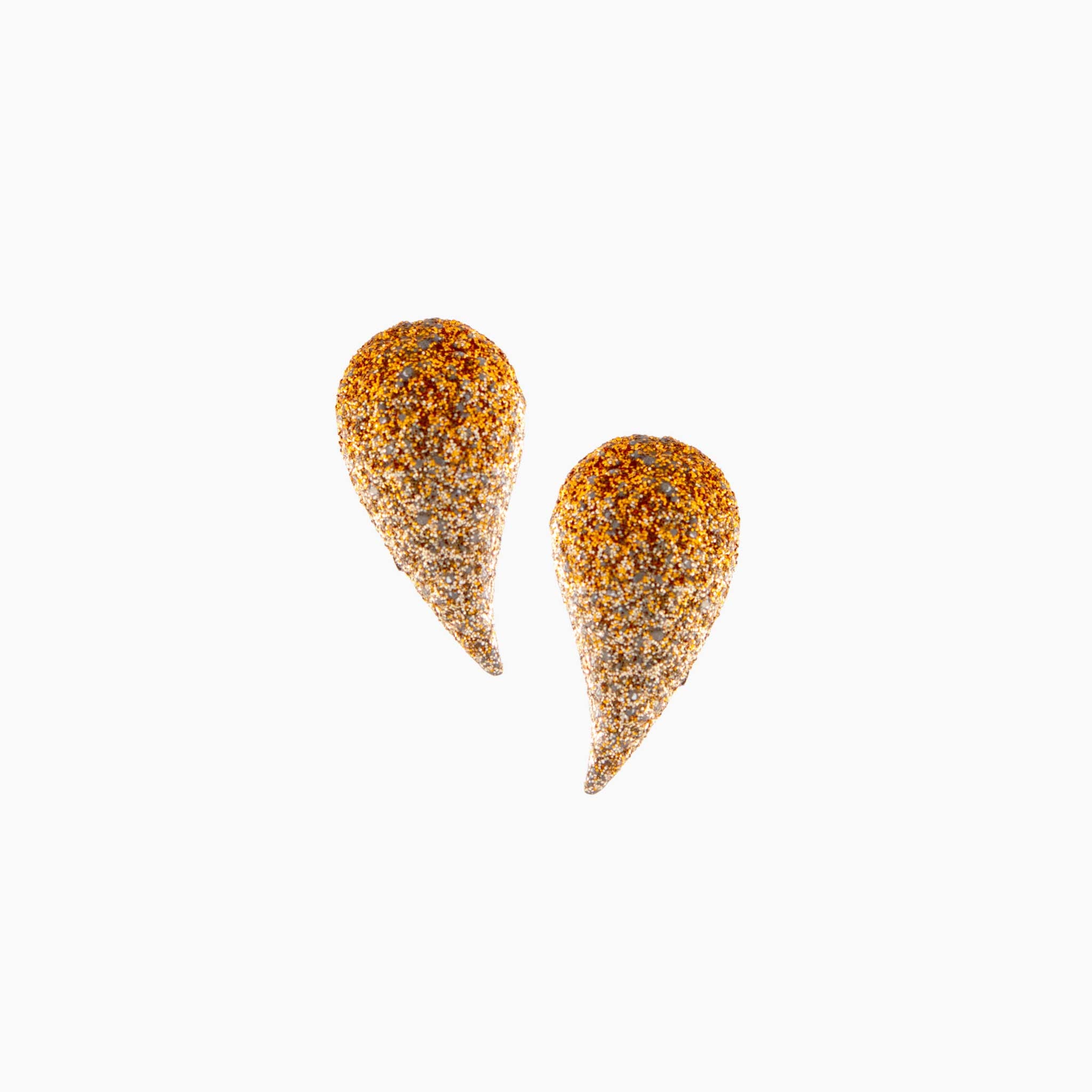 Pair of gold teardrop-shaped earrings on a white background