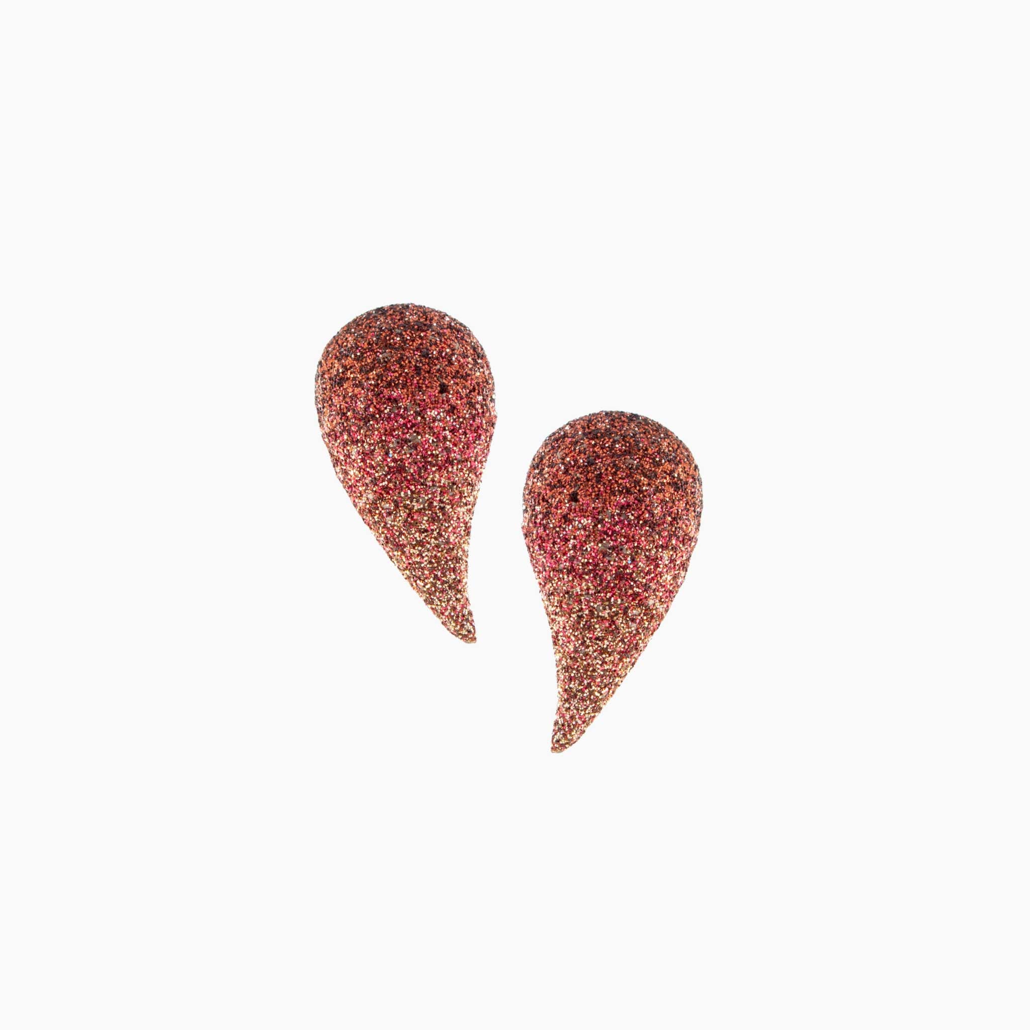 Teardrop-shaped earrings with a textured finish on a white background