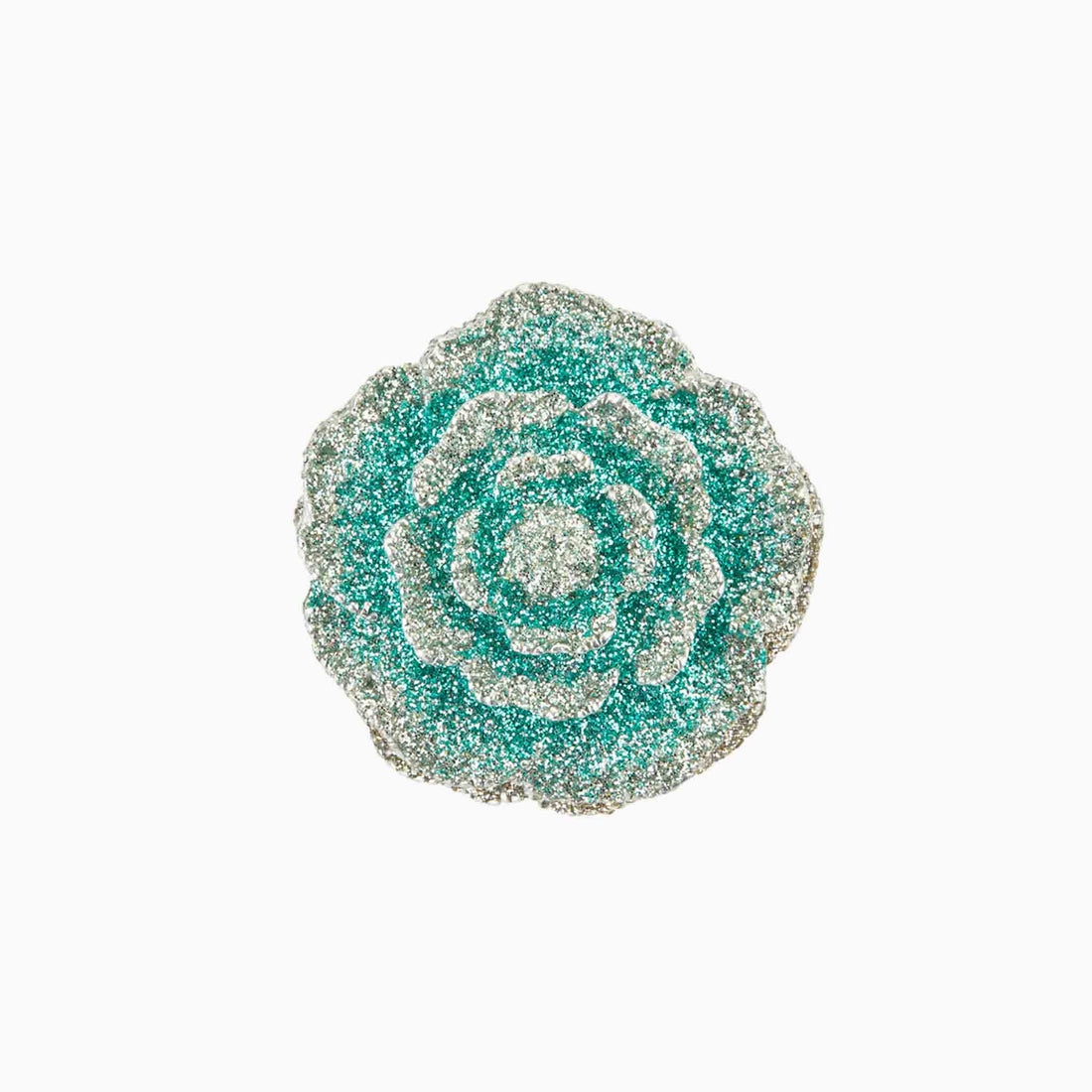 Decorative brooch with a floral design on a white background
