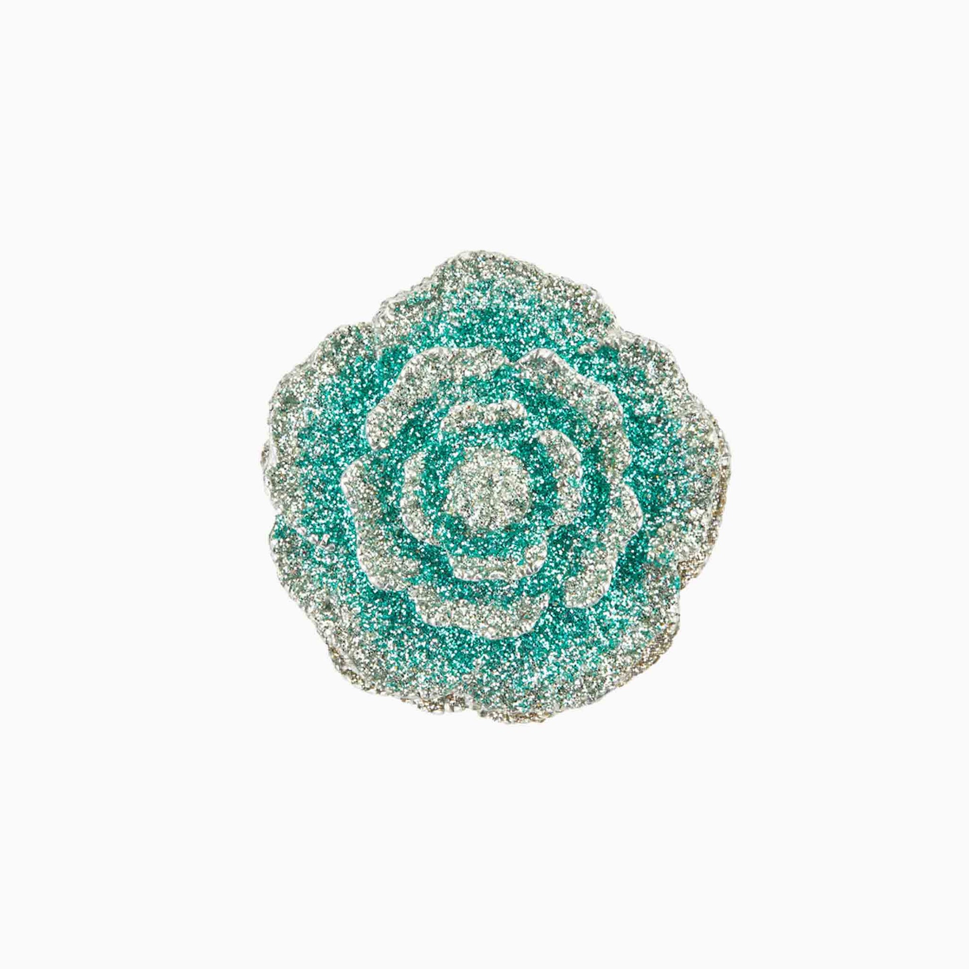 Decorative brooch with a floral design on a white background